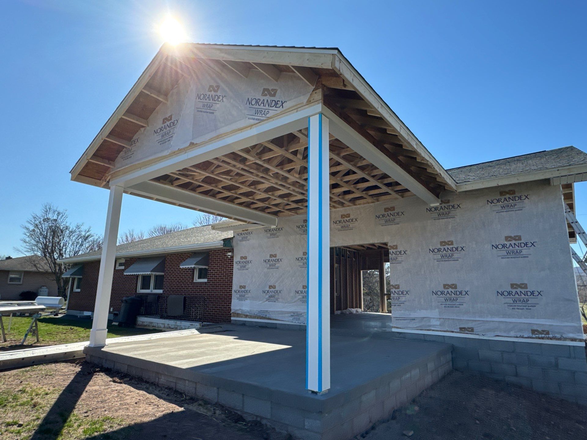 Tower City Residential Addition Featuring Gray Vinyl Siding and Garage by Esh Builders