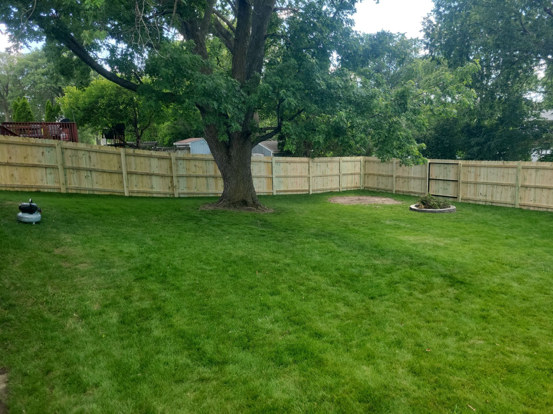 Pressure-Treated Pine Privacy Fence and Custom Gates in Waterloo by Perfect Picket Fence and Stain