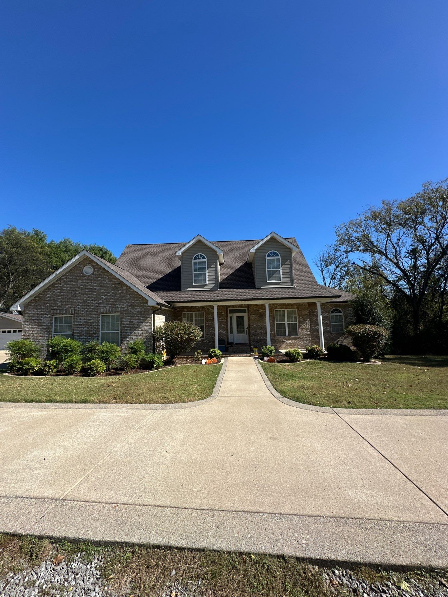 Roof and Gutter System Replacement with Stone Chimney Rebuild by Undersun Roofing 