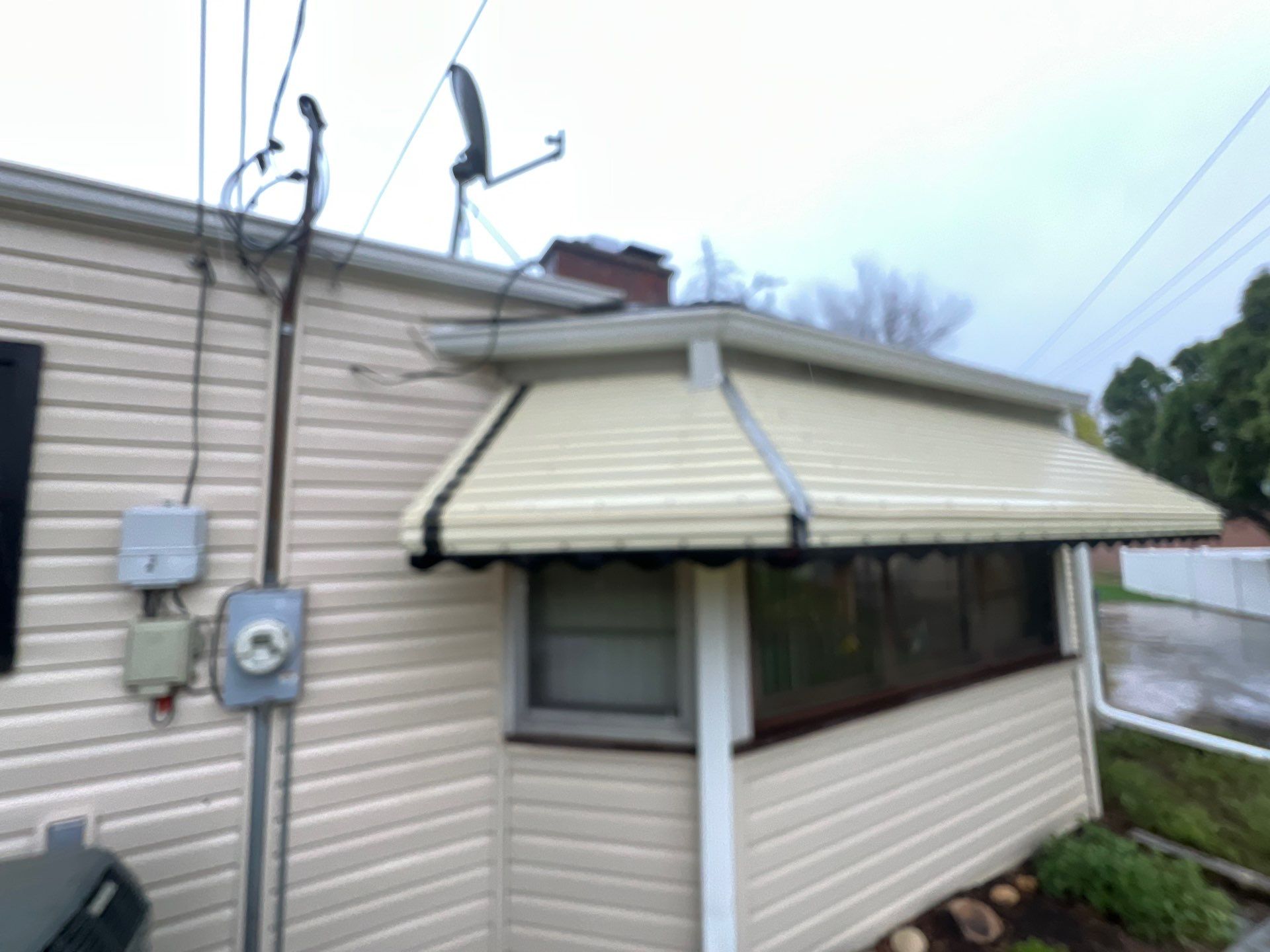 Housewashing  using Algaecide, soft wash soap by Northern Power Washing LLC.
