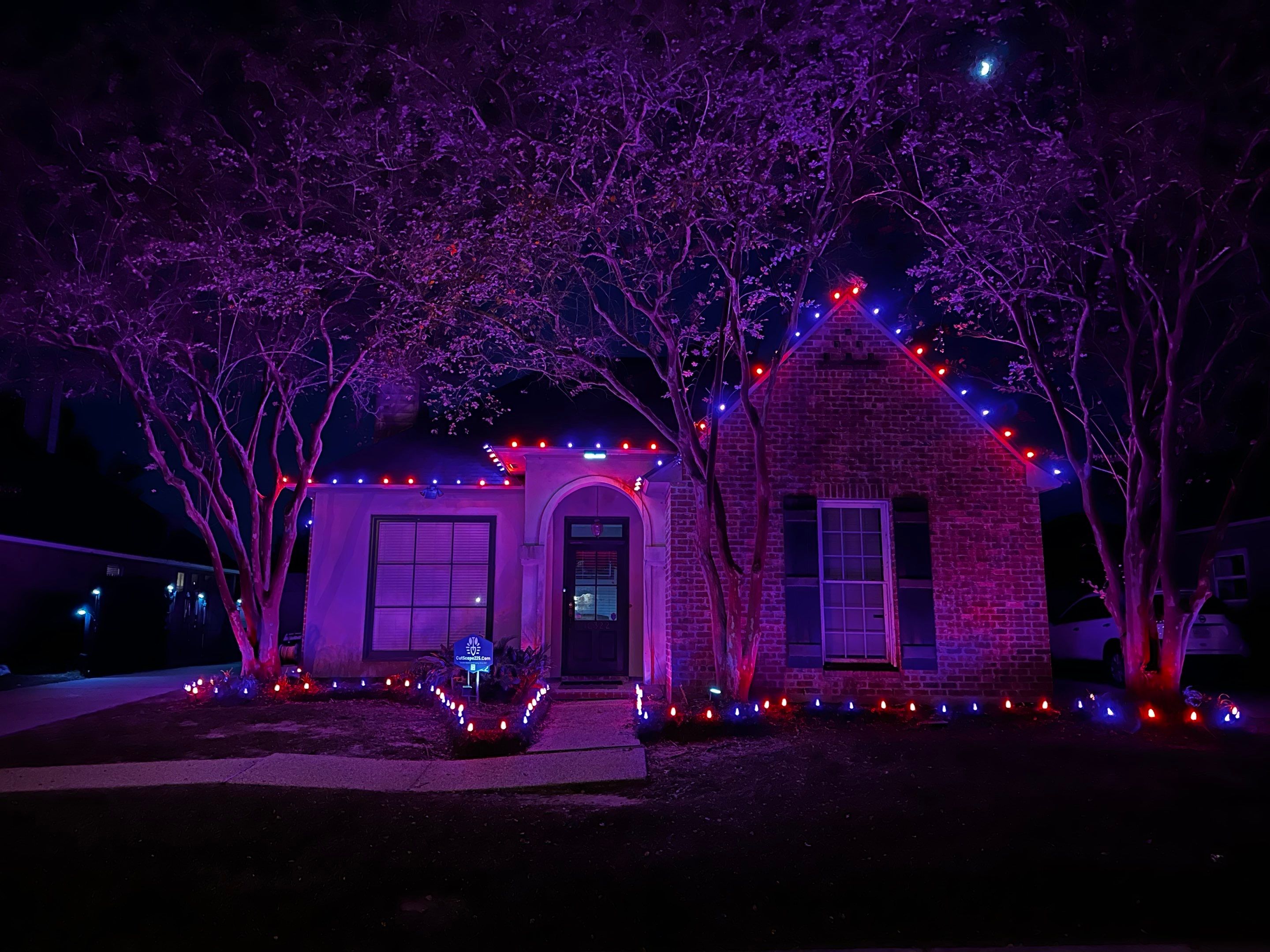 WINTER SERVICES: HOLIDAY LIGHTING using ROOFLINE PERIMETER LIGHTING: HALLOWEEN THEME WITH ORANGE AND PURPLE BULBS by CutScape, LLC.