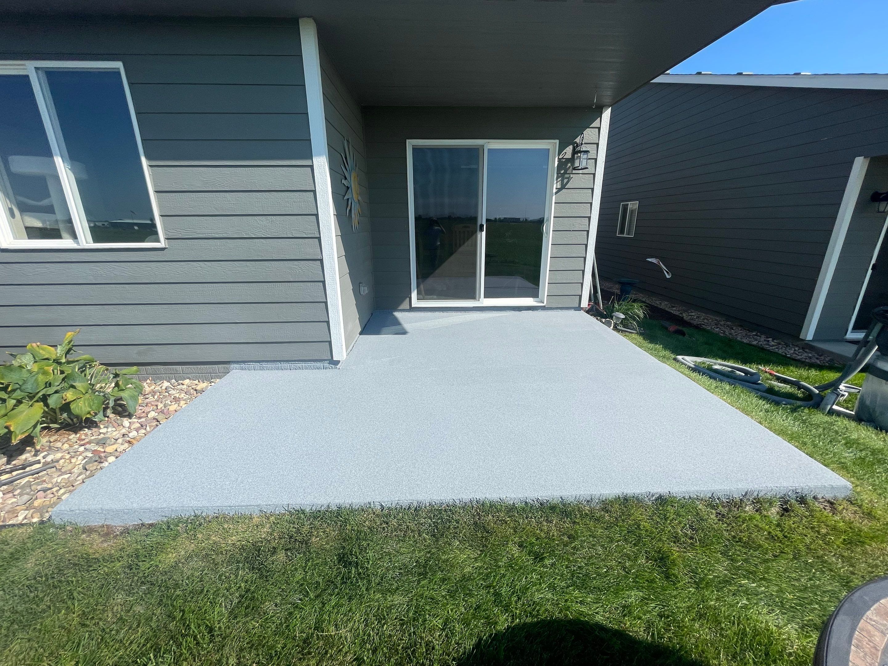 Starry Evening Concrete Patio Coating Installation in Tea by Select Painting, Coatings & Garage Cabinets