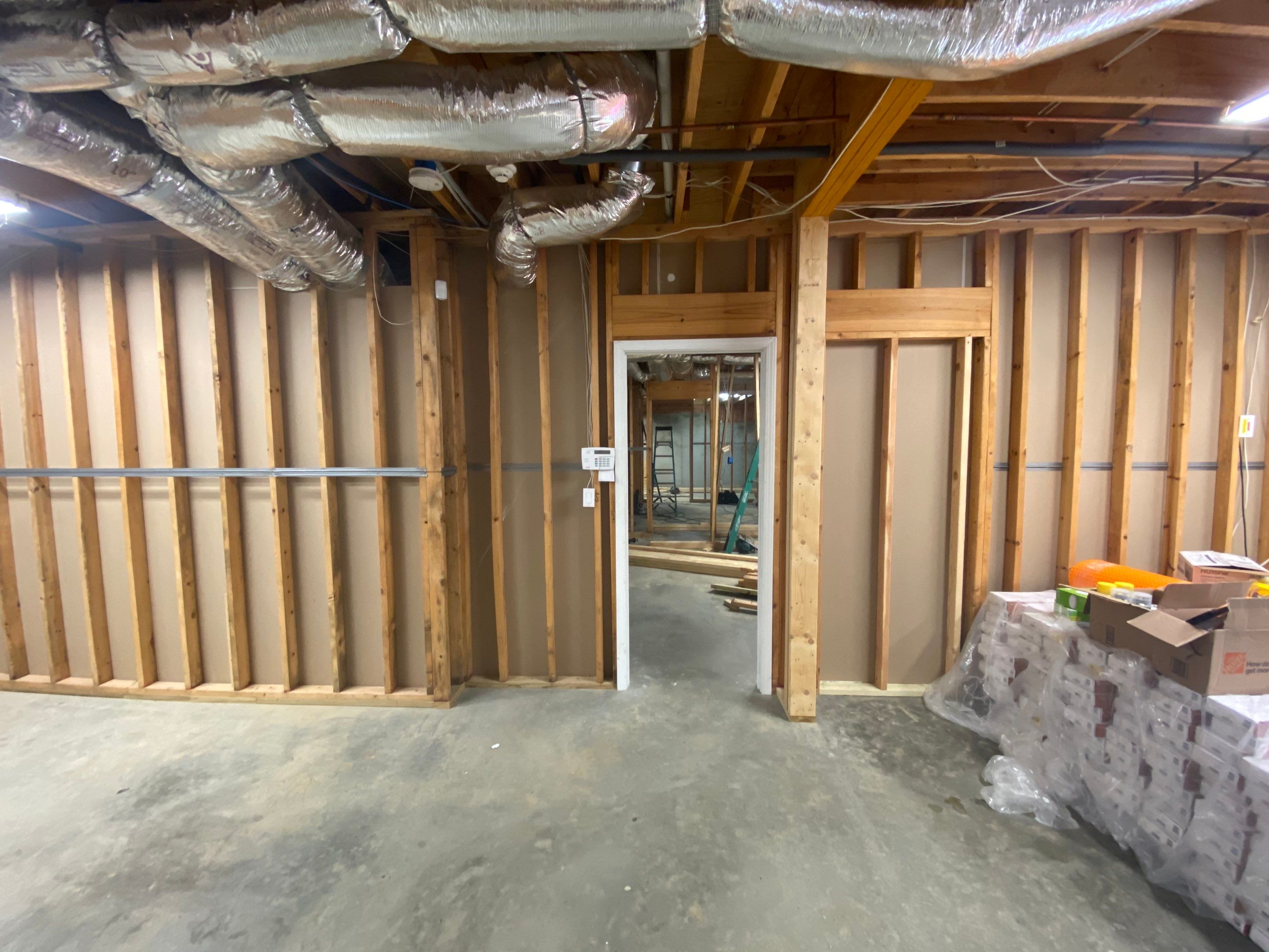 Acworth Basement Transformation With Wet Bar and Stone Fireplace by Swift Home Renovations