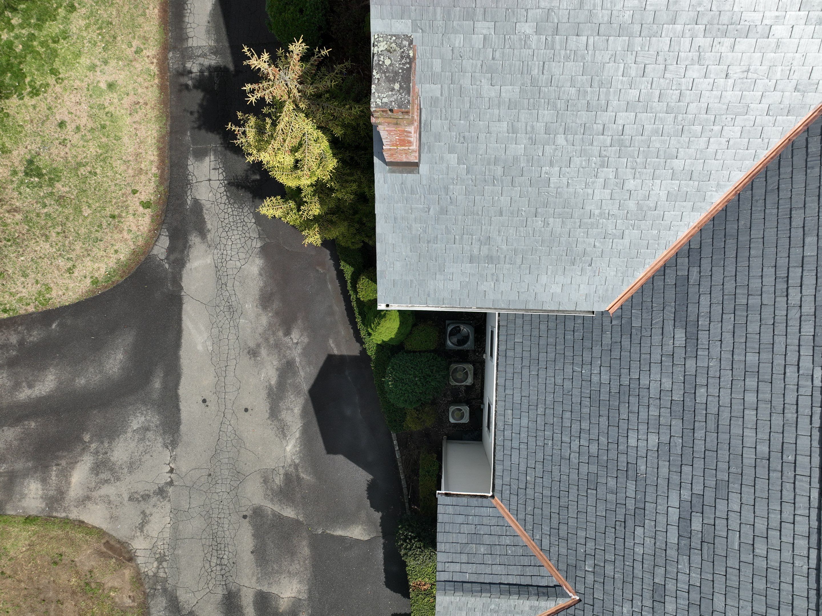 Residential Roofing Installation using Vermont Slate by A Plus Exterior