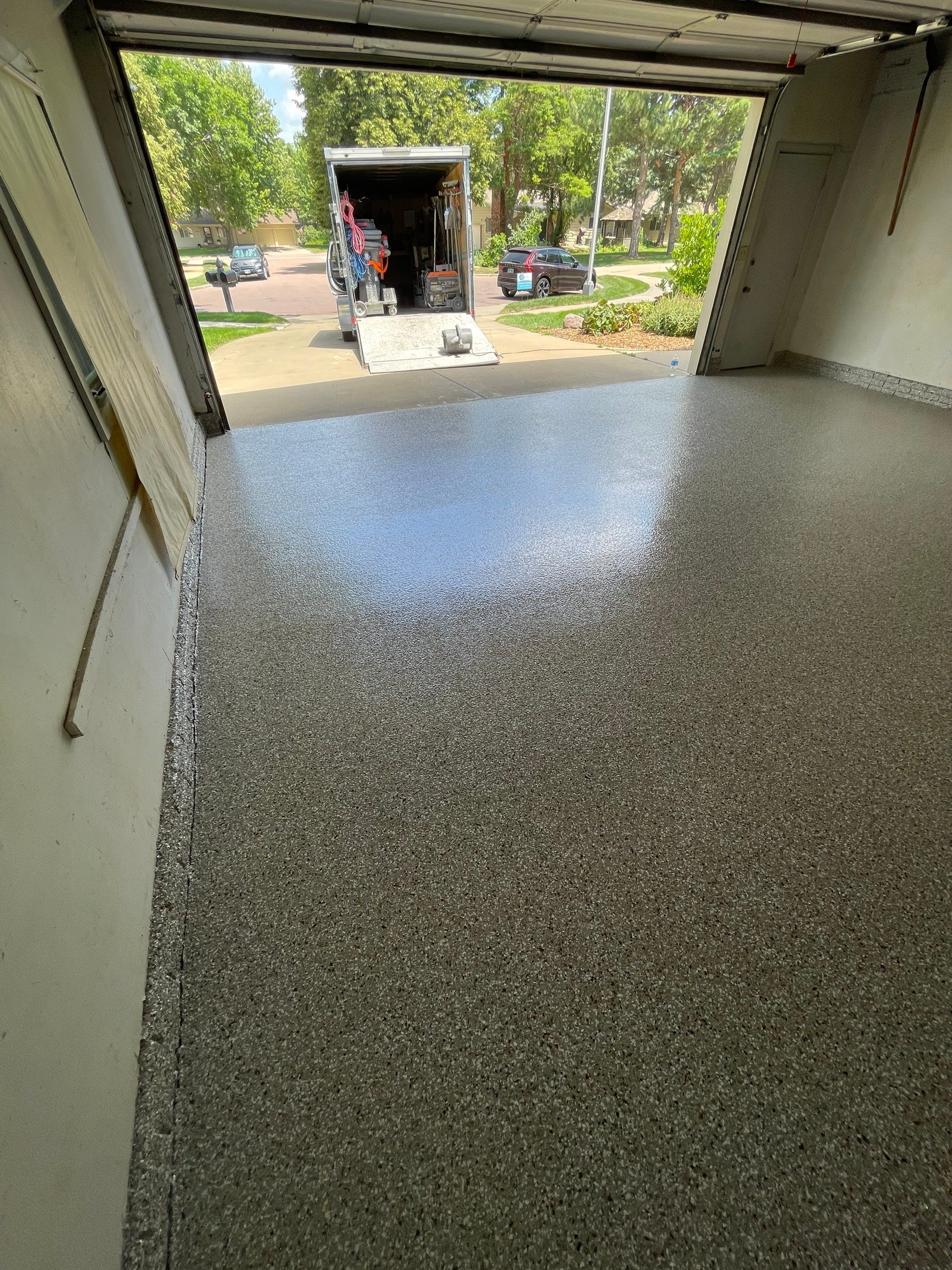 Custom Creekbed Garage Floor Coating in Sioux Falls by Select Painting, Coatings & Garage Cabinets
