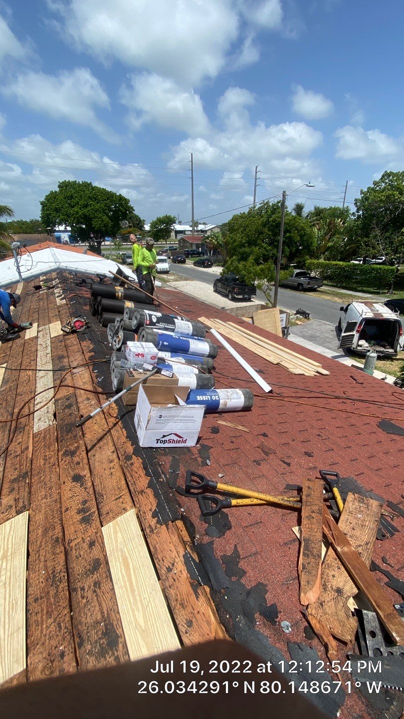 Standing Seam Metal & Flat Re-Roof using 1.5" Nail Strip 24ga Black Matte Kynar Coated Standing Seam Metal Panels by Morton Roofing, Inc.