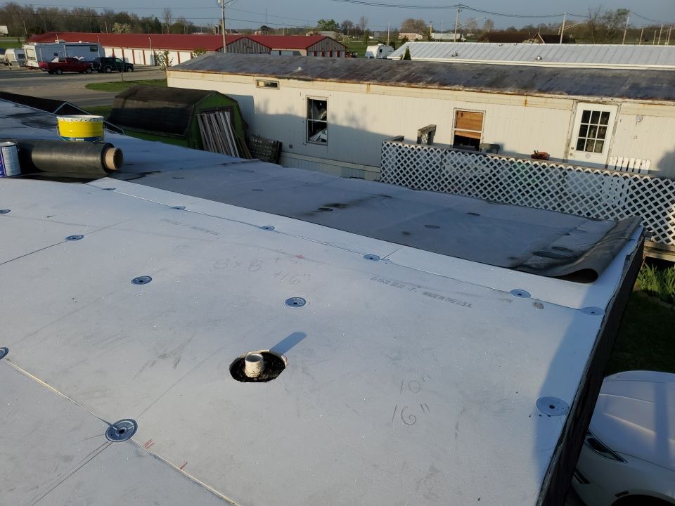 Residential Roofing Installation using 60 mil rubber roof  by Nitro Roofing and Construction