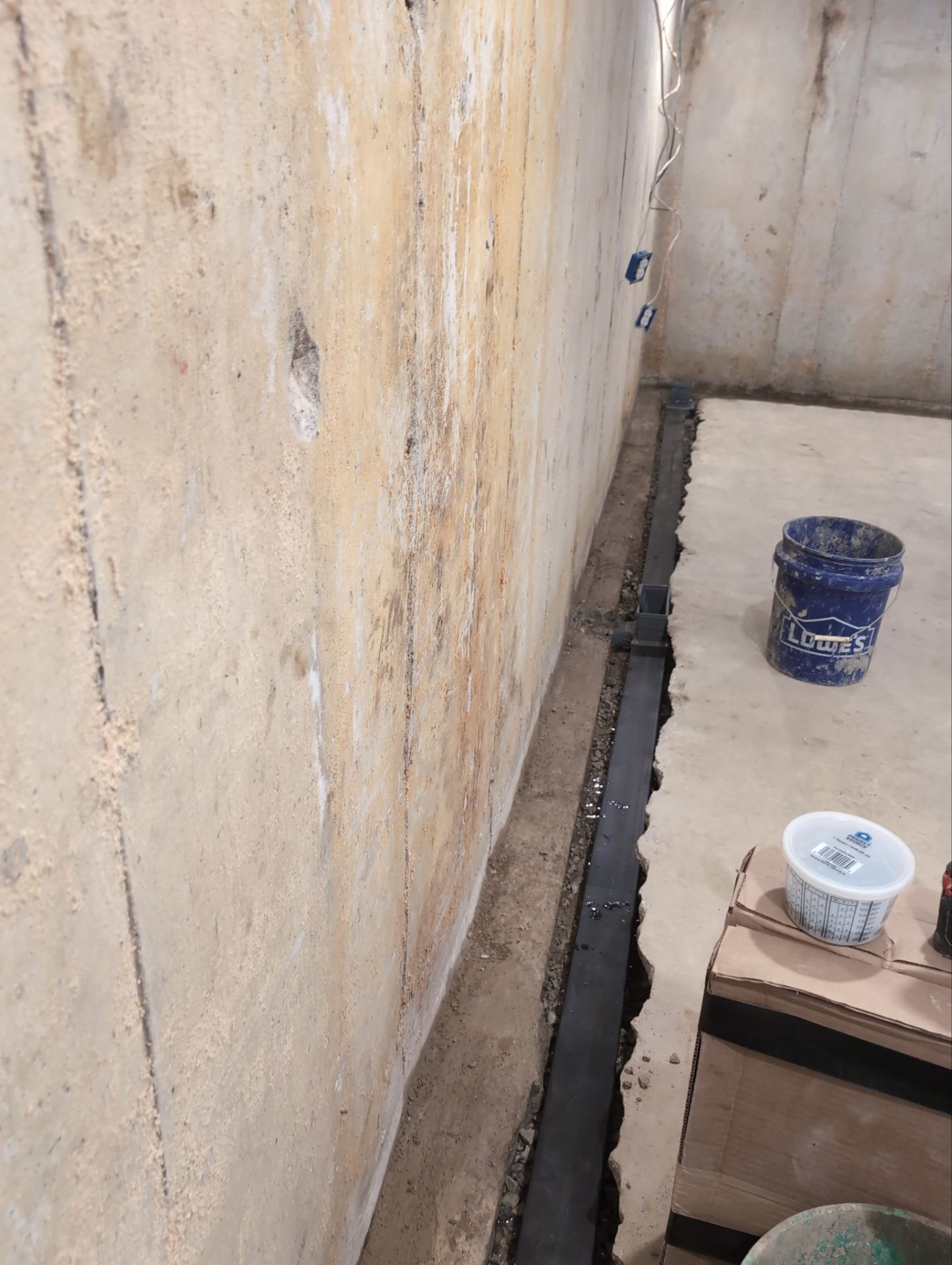 Interior Basement Waterproofing System and Egress Window Installation by Toledo Basement Repair 