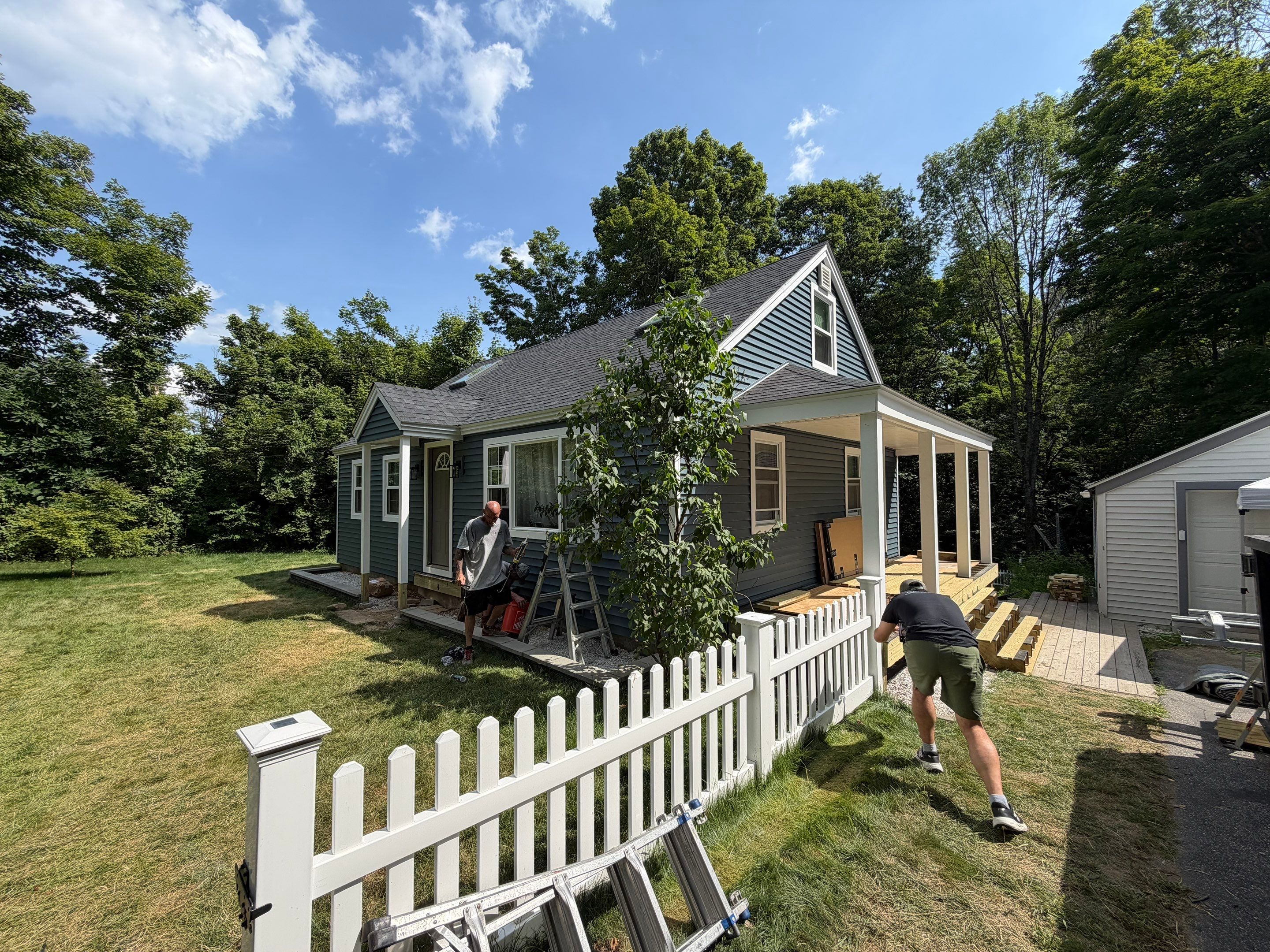 Complete Exterior Renovation Featuring Owens Corning Shingles and Vinyl Siding by Tall pine roofing