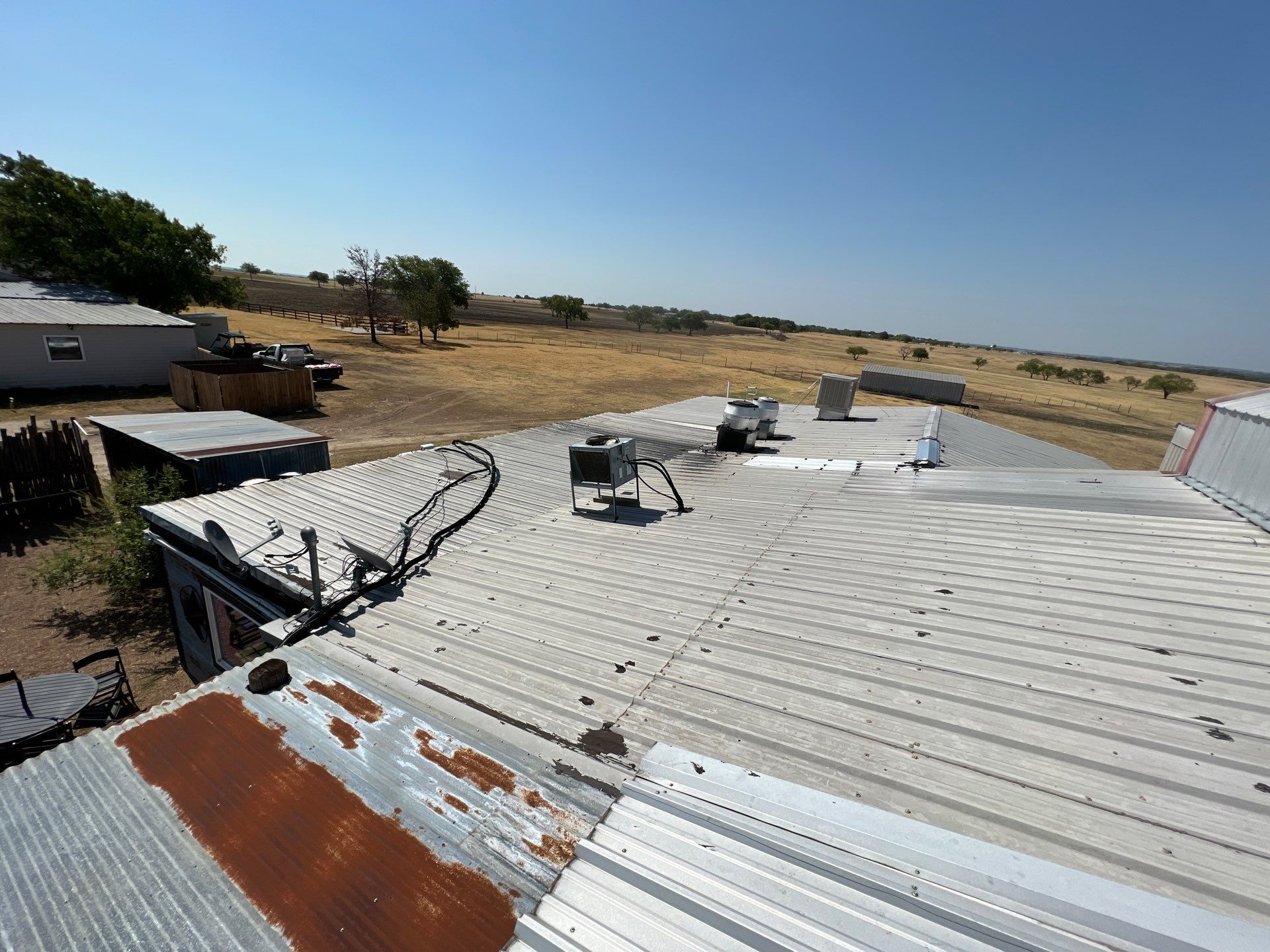 Commercial Roofing Repair using TRP #924 Eterna-Sil Premium Silicone Roof Coating by Harvey Roofing & Construction