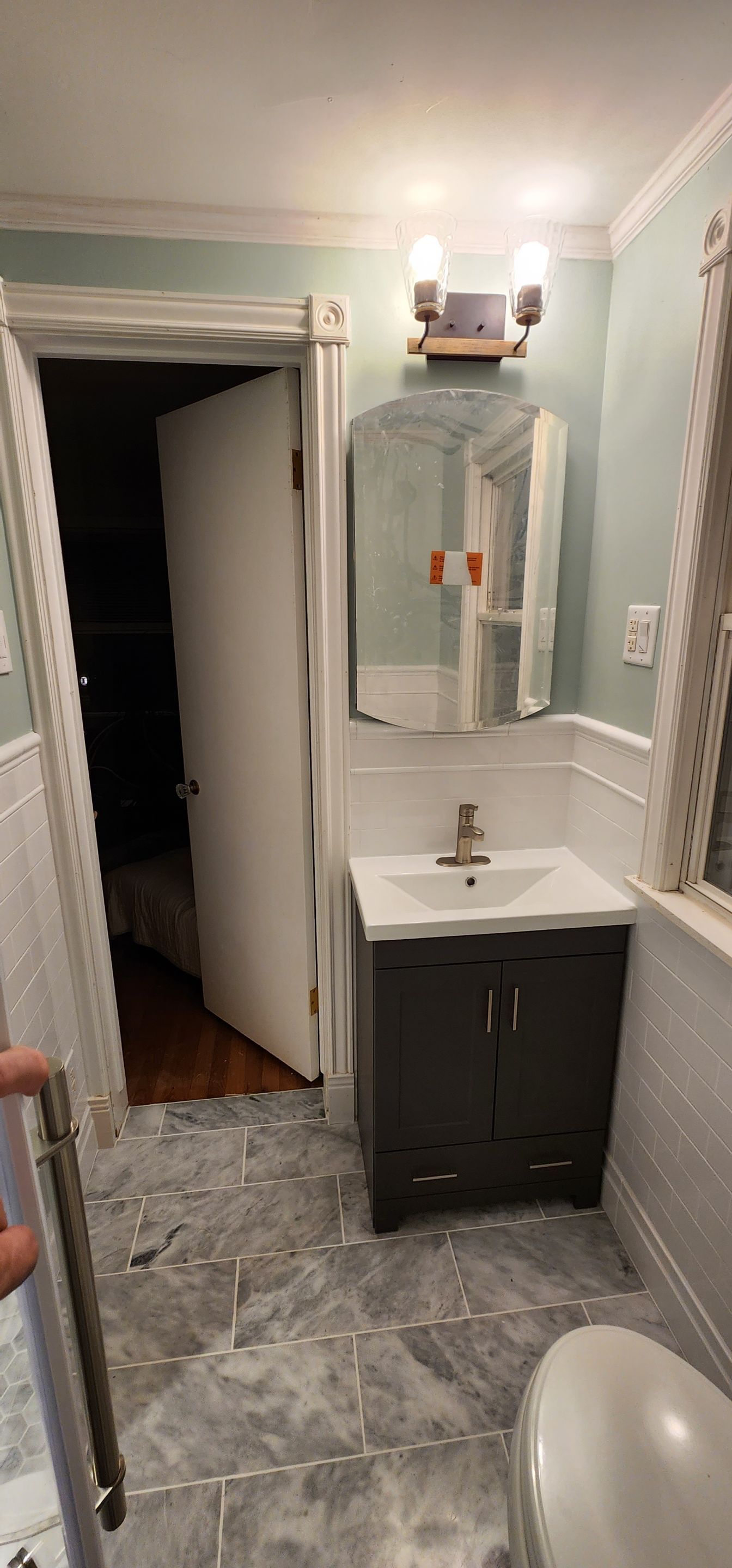 Full bathroom, tile shower, tile floor, tile wainscoting by The Shower Company