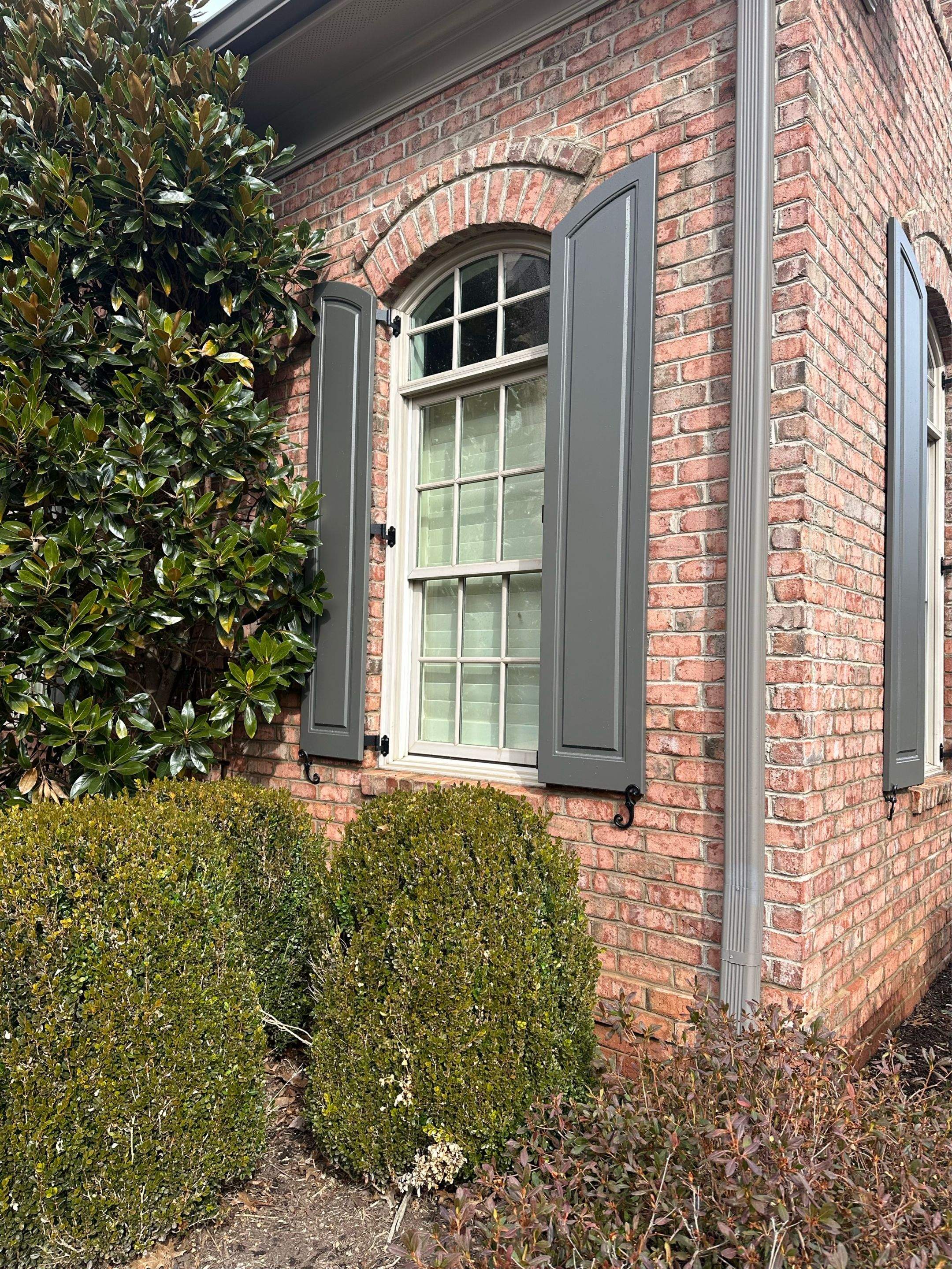 Exterior raised panel shutters by Southern Traditions Window Fashions