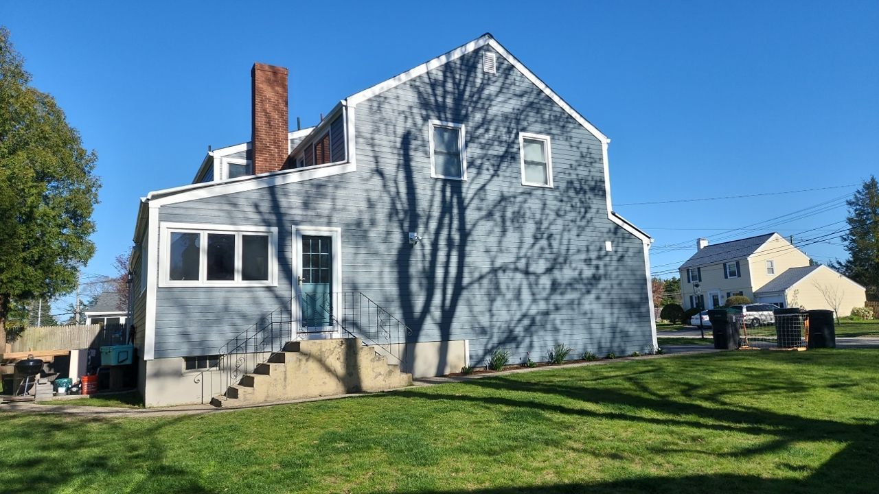 James Hardie siding, new metal roof and couple windows being installed. by UBrothers Construction