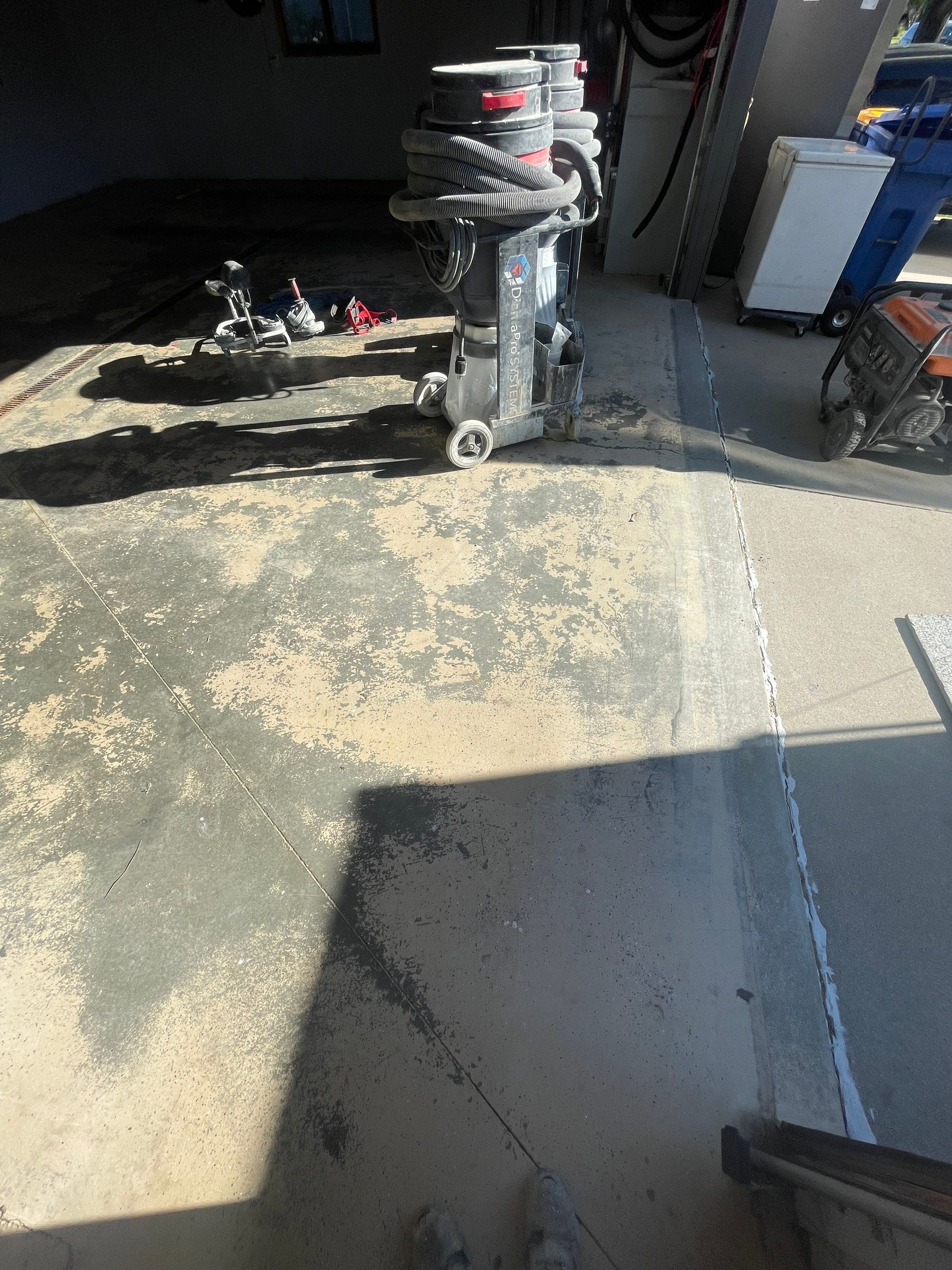 Full Garage Floor Epoxy Coating Installation in Dell Rapids by Select Painting, Coatings & Garage Cabinets