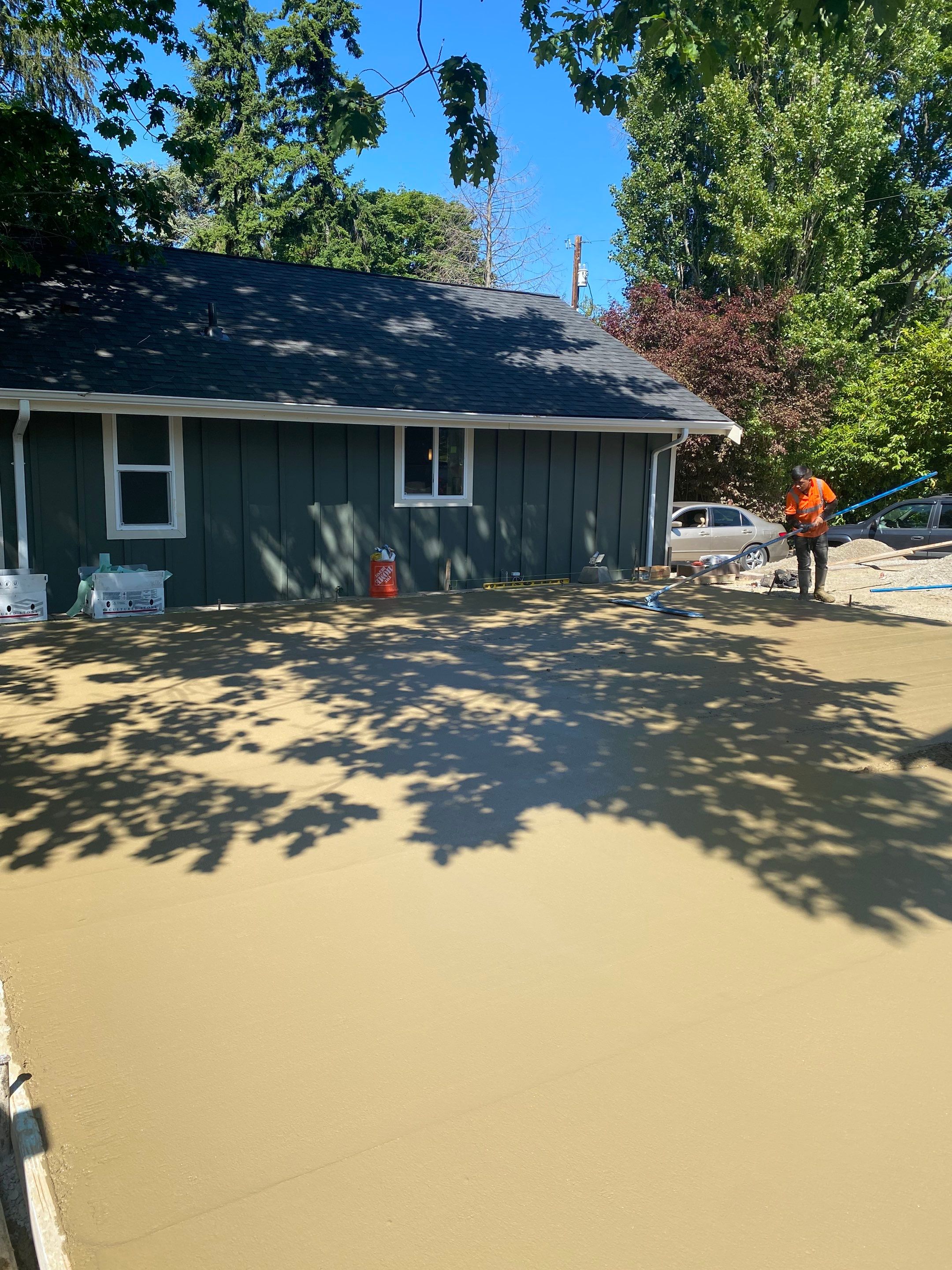 Patio Installation using Concrete, Retaining walls, and Turf install by Jireh Asphalt & Concrete Inc 