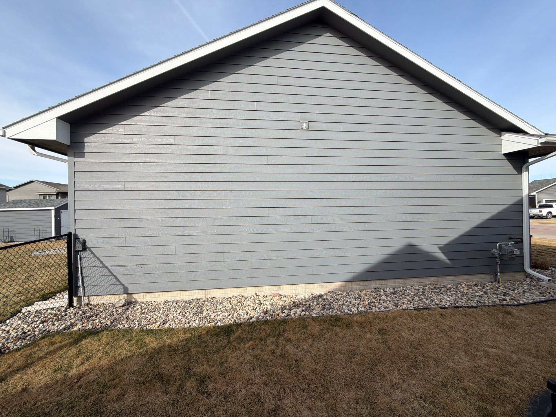 Residential Exterior Painting and Siding Refresh in Sioux Falls by Select Painting, Coatings & Garage Cabinets