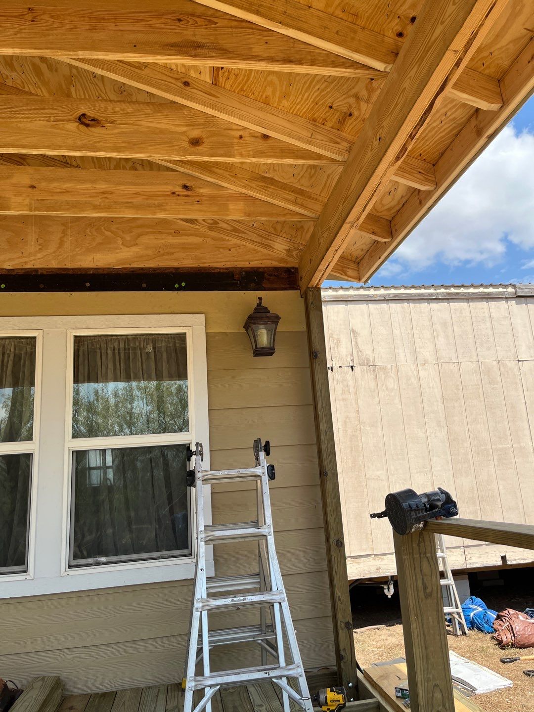 Front Porch Sitt'n by Bayfront Roofing and Construction