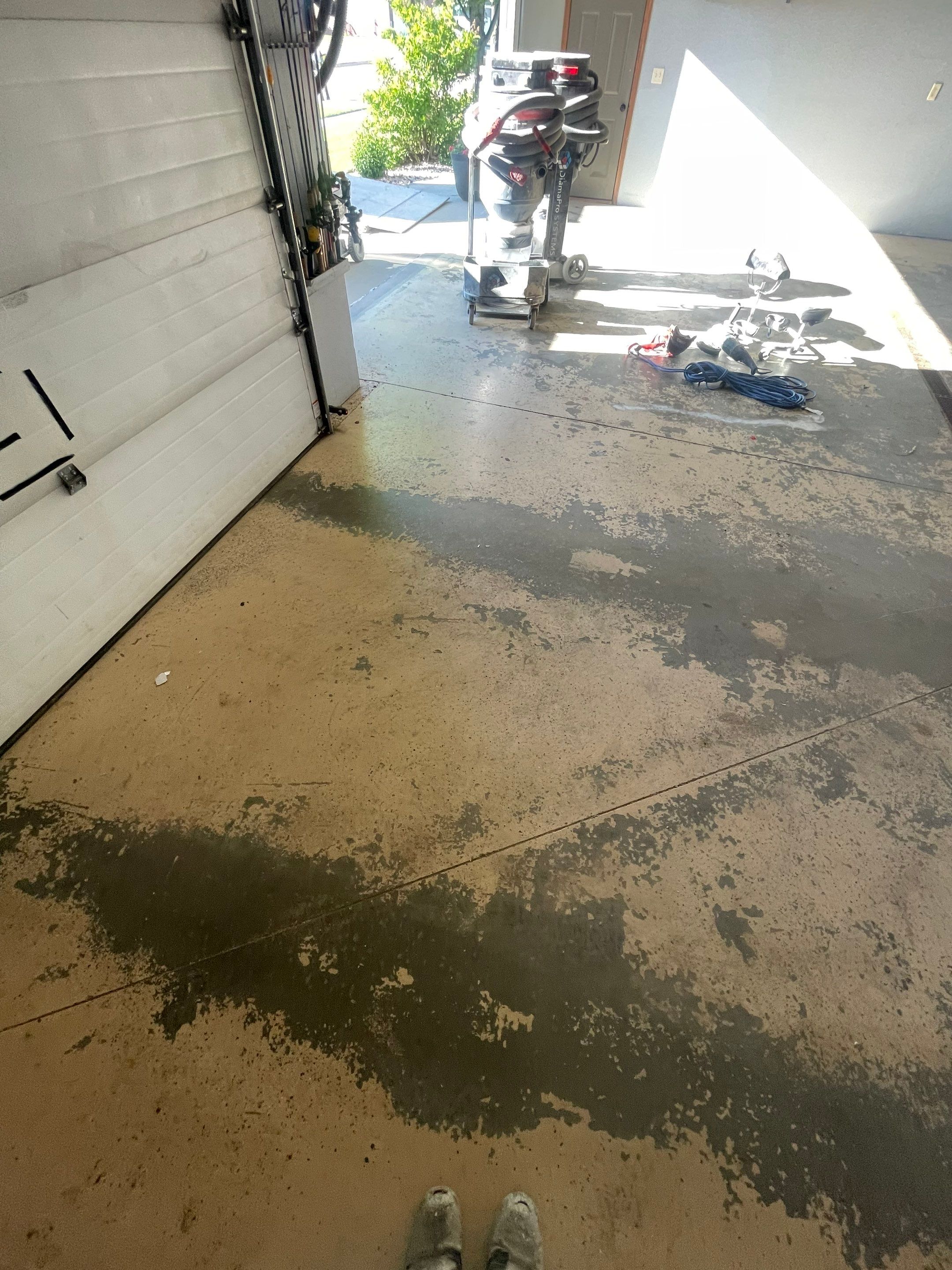Full Garage Floor Epoxy Coating Installation in Dell Rapids by Select Painting, Coatings & Garage Cabinets