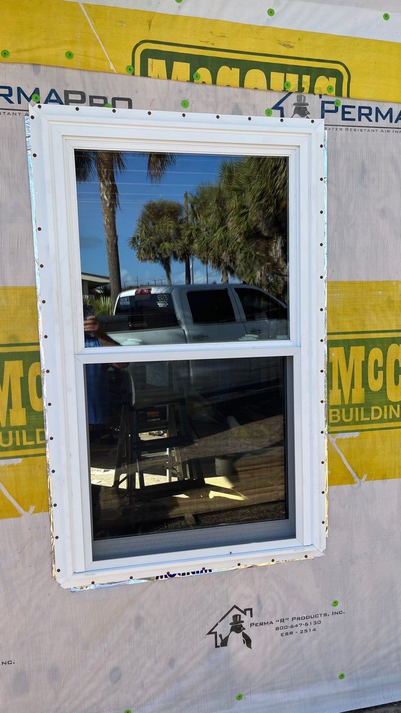 Installing Windows on a Submarine  by Bayfront Roofing and Construction
