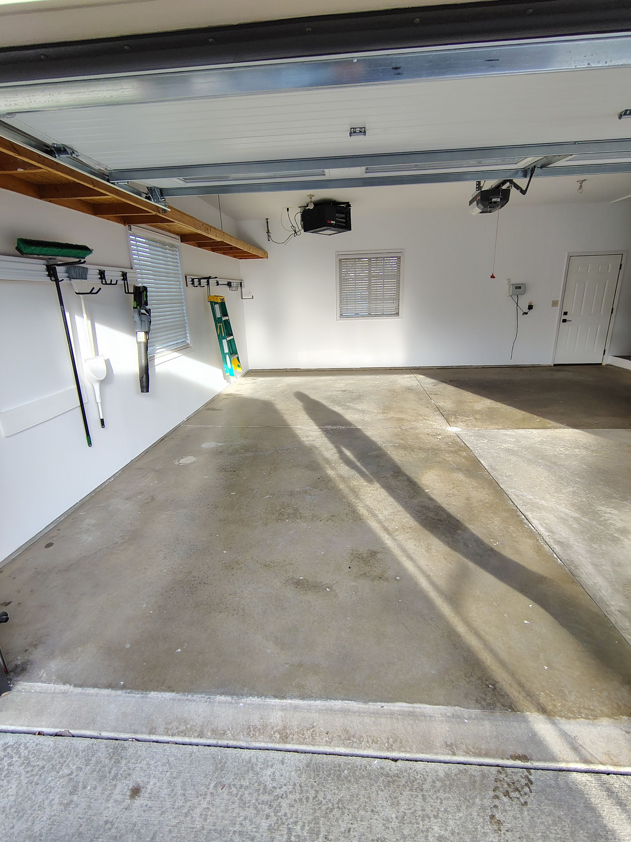 Grey Speckled Epoxy Garage Floor Coating in Sioux Falls by Select Painting, Coatings & Garage Cabinets