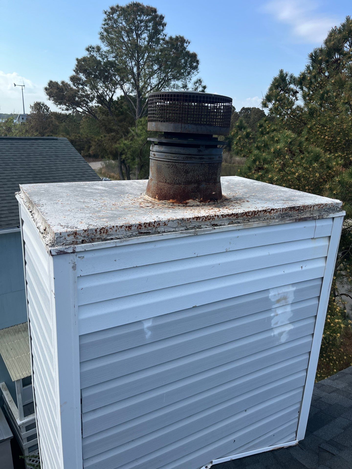 Chimney Leak Repair - Chase Cover, Cap, and Siding by Premier Chimney and Roofing