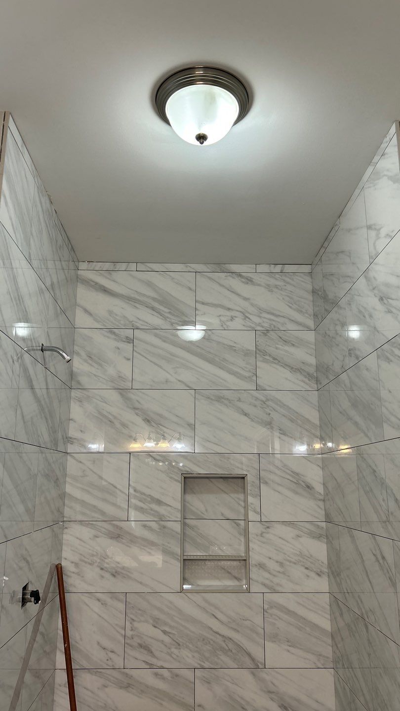 Tile shower remodel and heated floors by Footprints Floors of Nashville