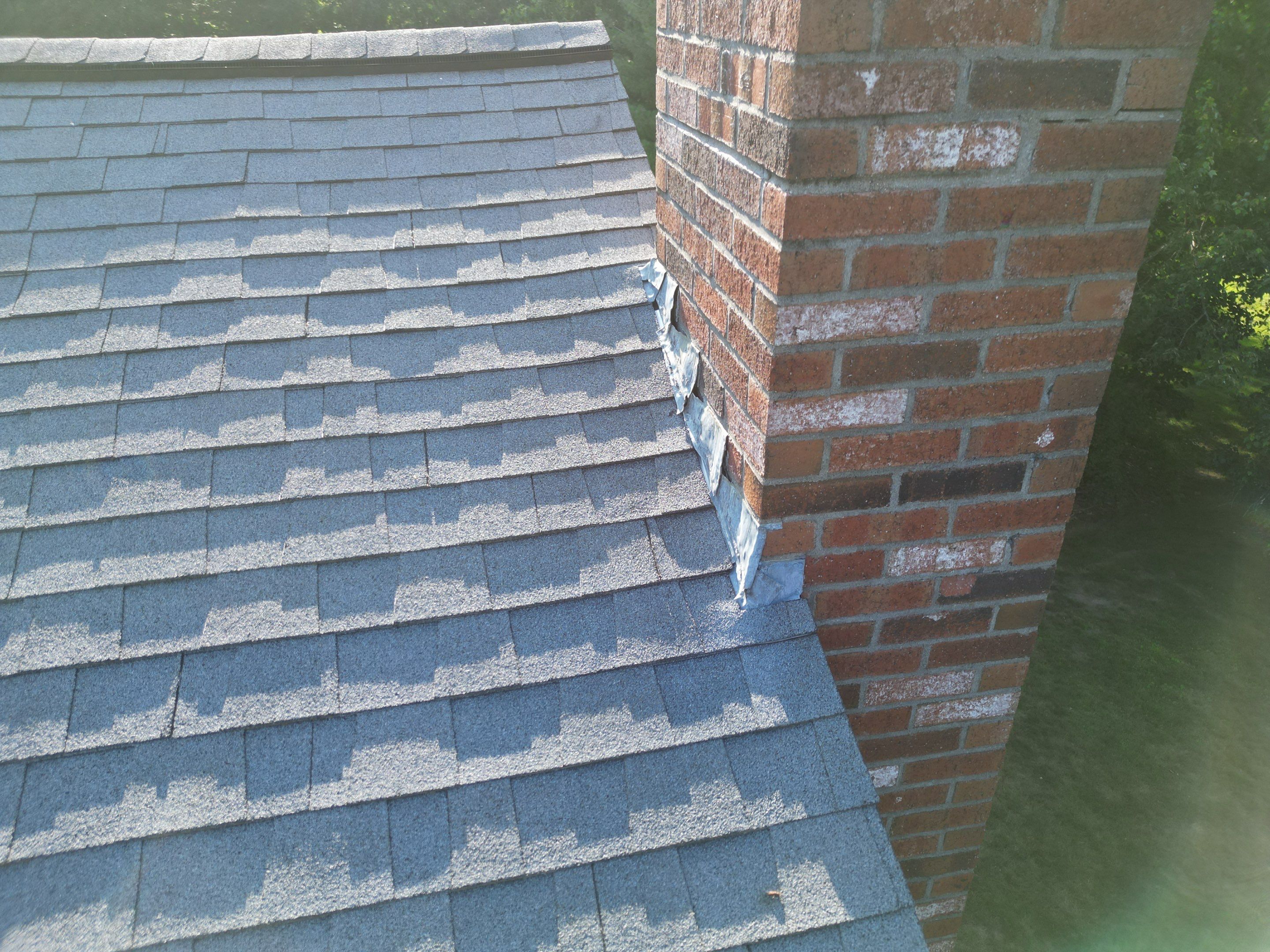 Complete Roof Replacement with Chimney Flashing, Gutter Guard System, and Vinyl Siding Repairs by Mighty Dog Roofing of Greater Middlesex County
