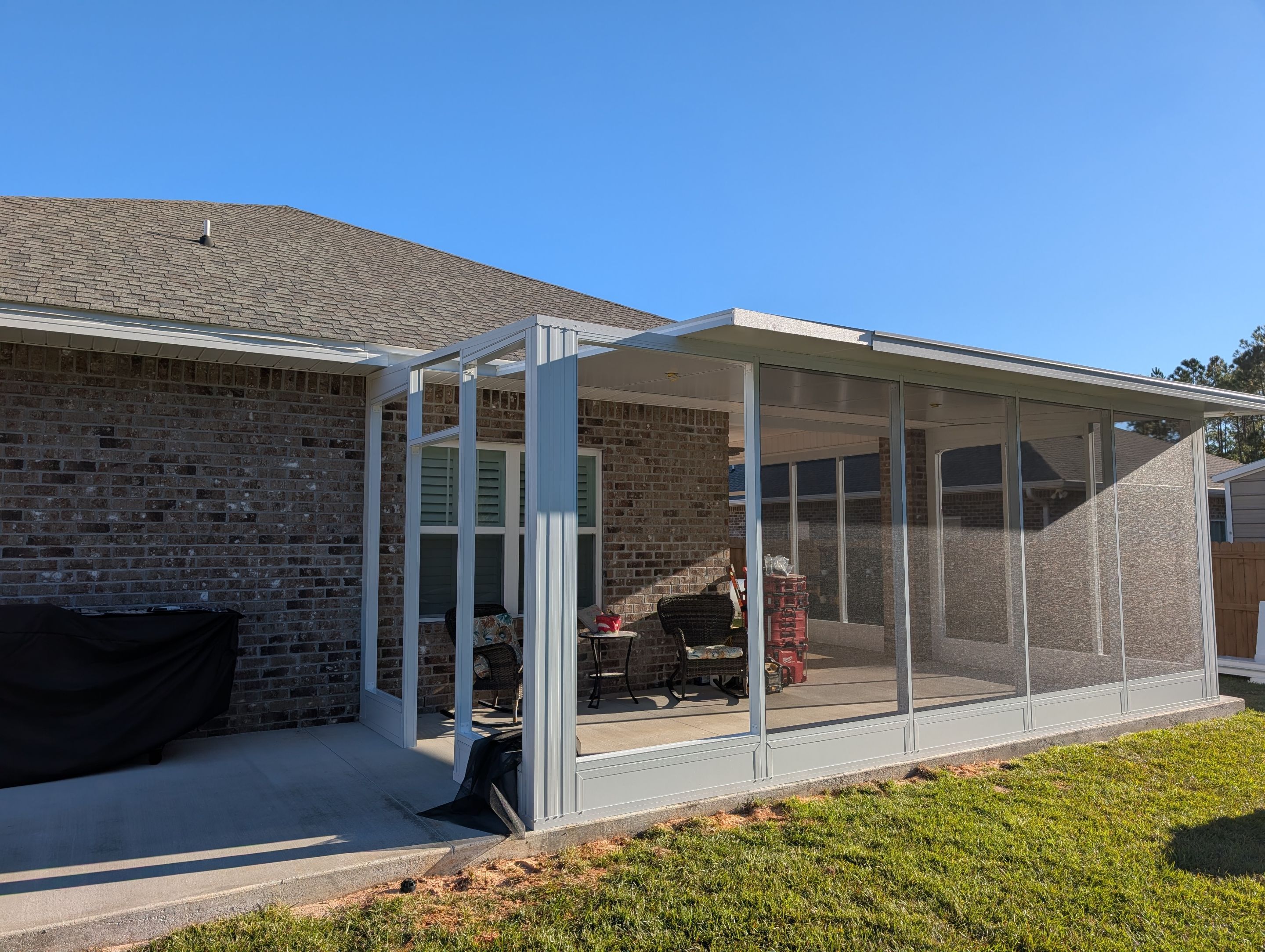 Home addition w/Vinyl 4-Track Windows by Titan Sunrooms