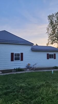 Residential Roofing Installation using Exposed Fastener Metal Roof