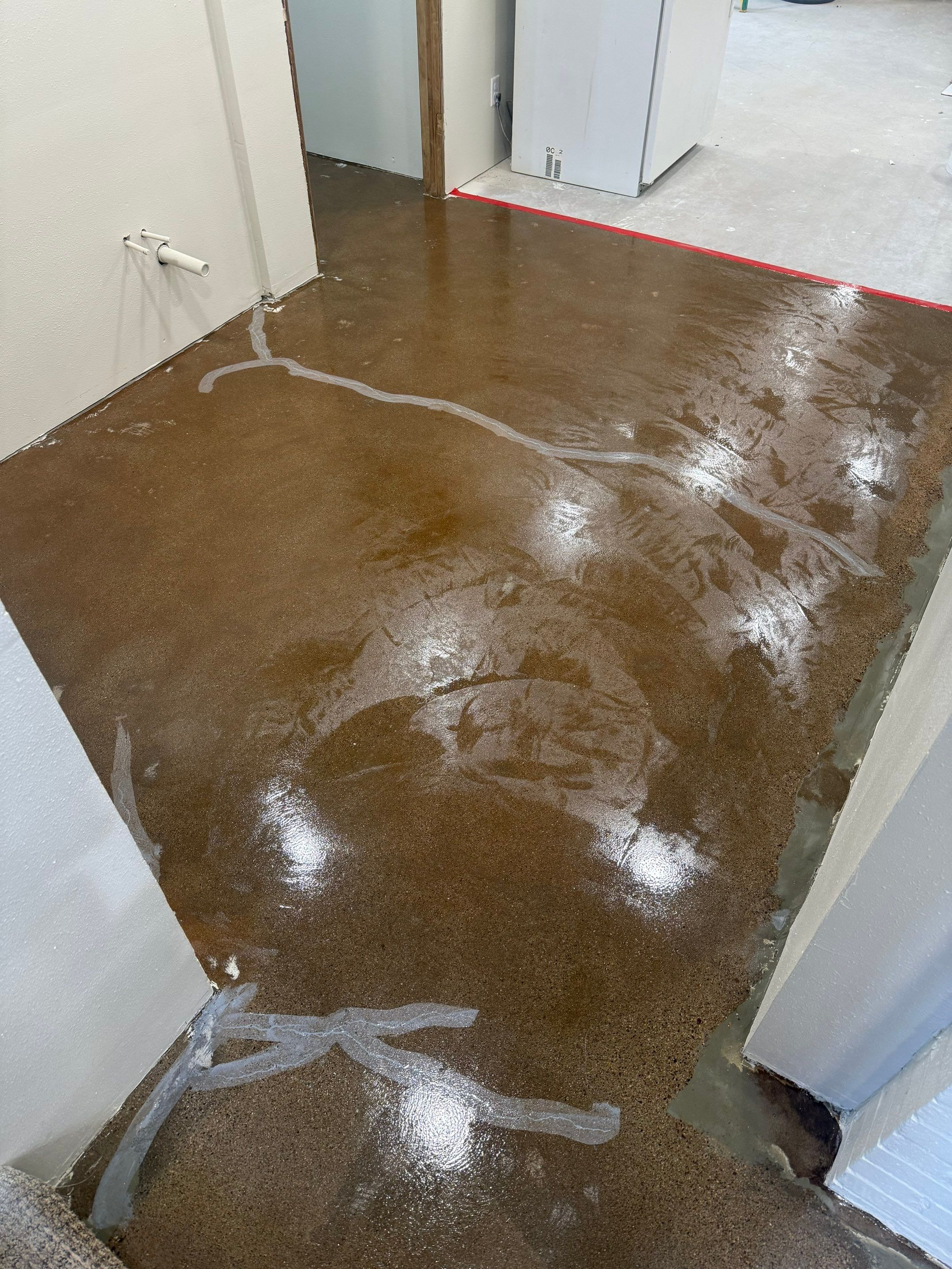 High-Gloss Epoxy Floor Coating and Basement Renovation in Rock Rapids by Select Painting, Coatings & Garage Cabinets