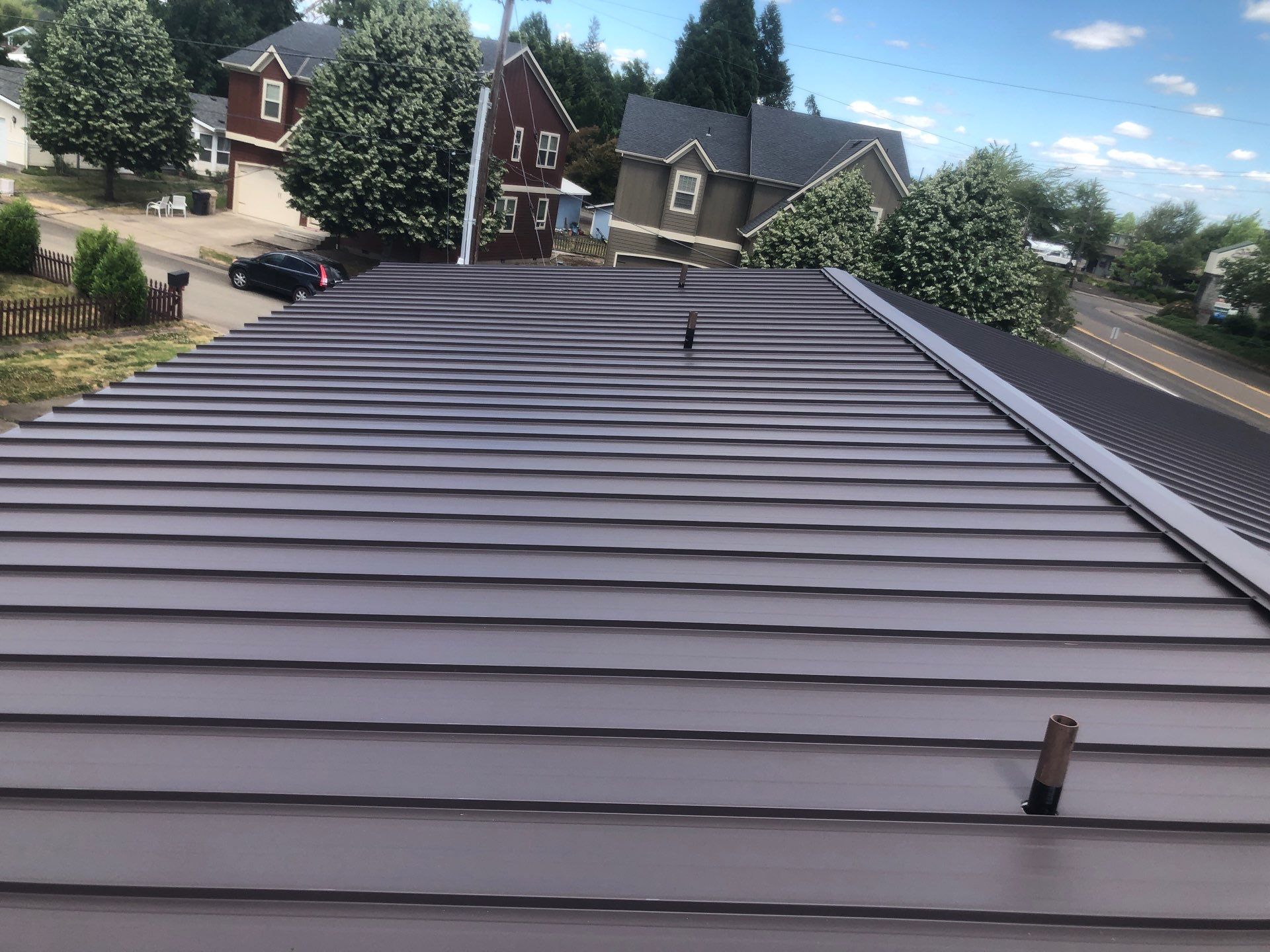 Commercial Flat Roof Installation using Bruce and Dana Snap Lock Metal (Color: Brown) by Orezona Building & Roofing Company, Inc.