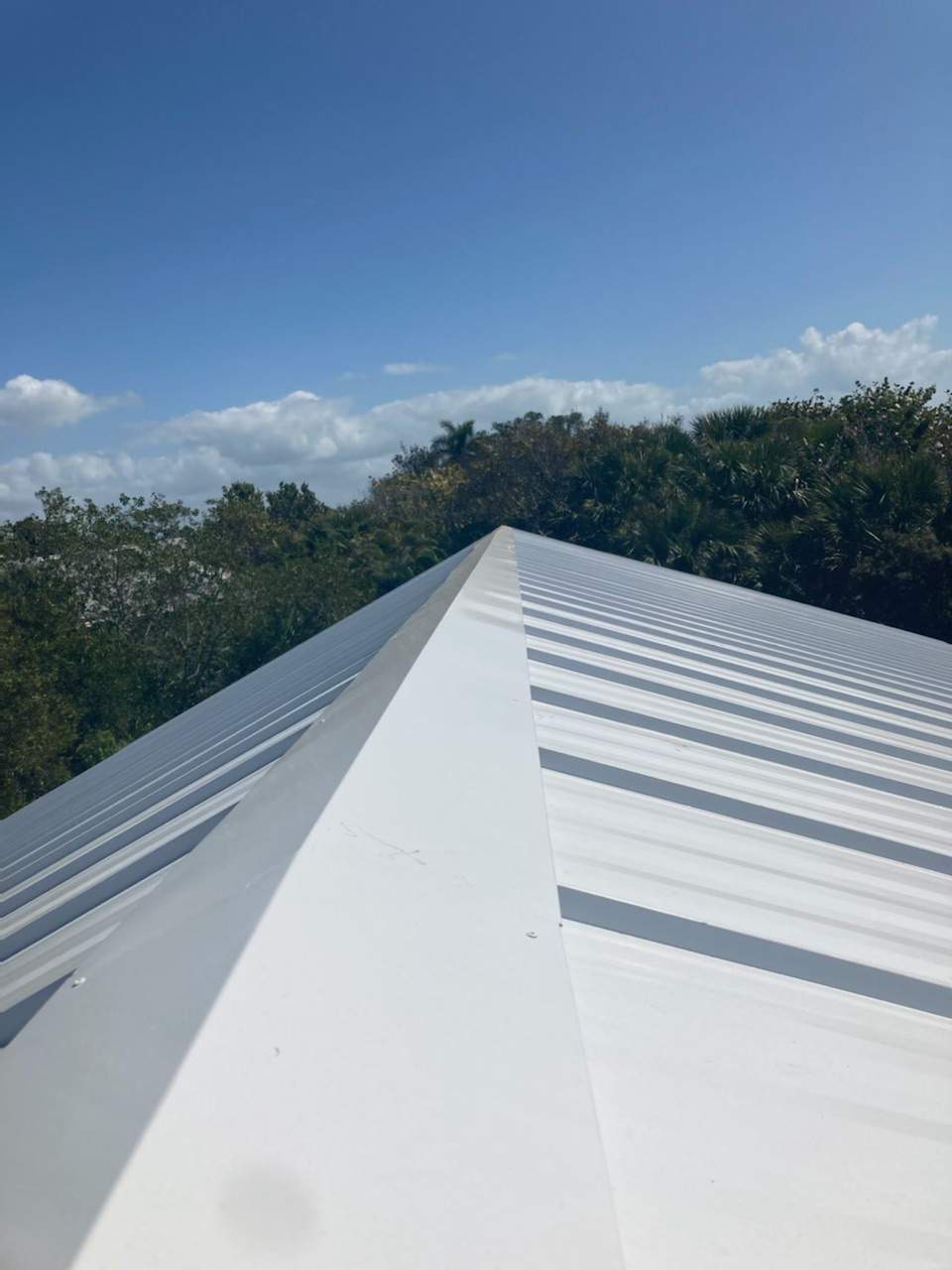 Residential Roofing Installation using Gulf Coast Metals Gulf Seam Panels by Four Peaks Roofing