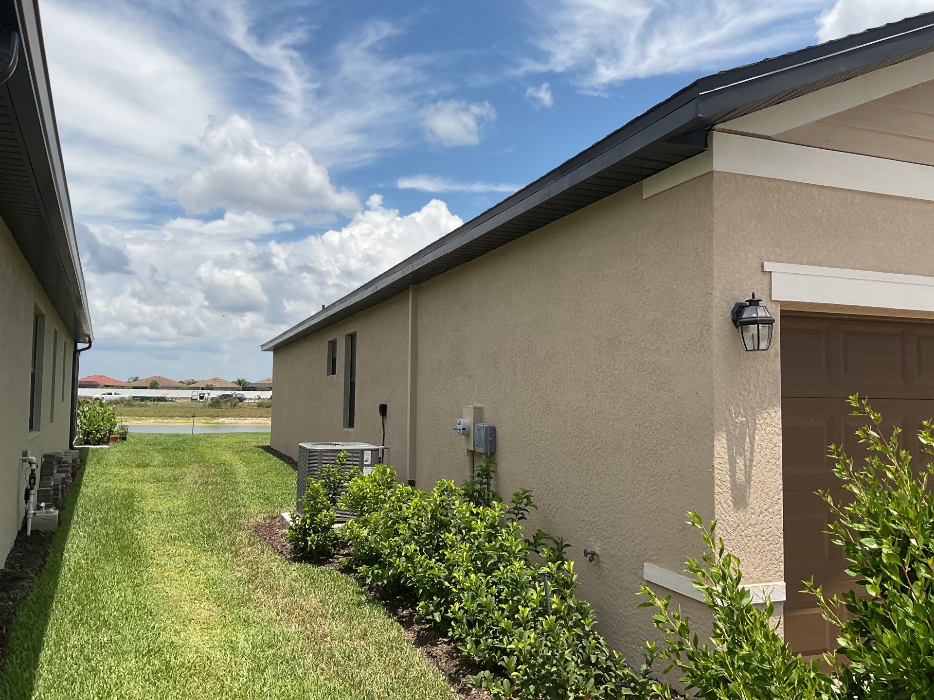 Brown Seamless Gutters for Homes in Fort Myers by Gutter Professors