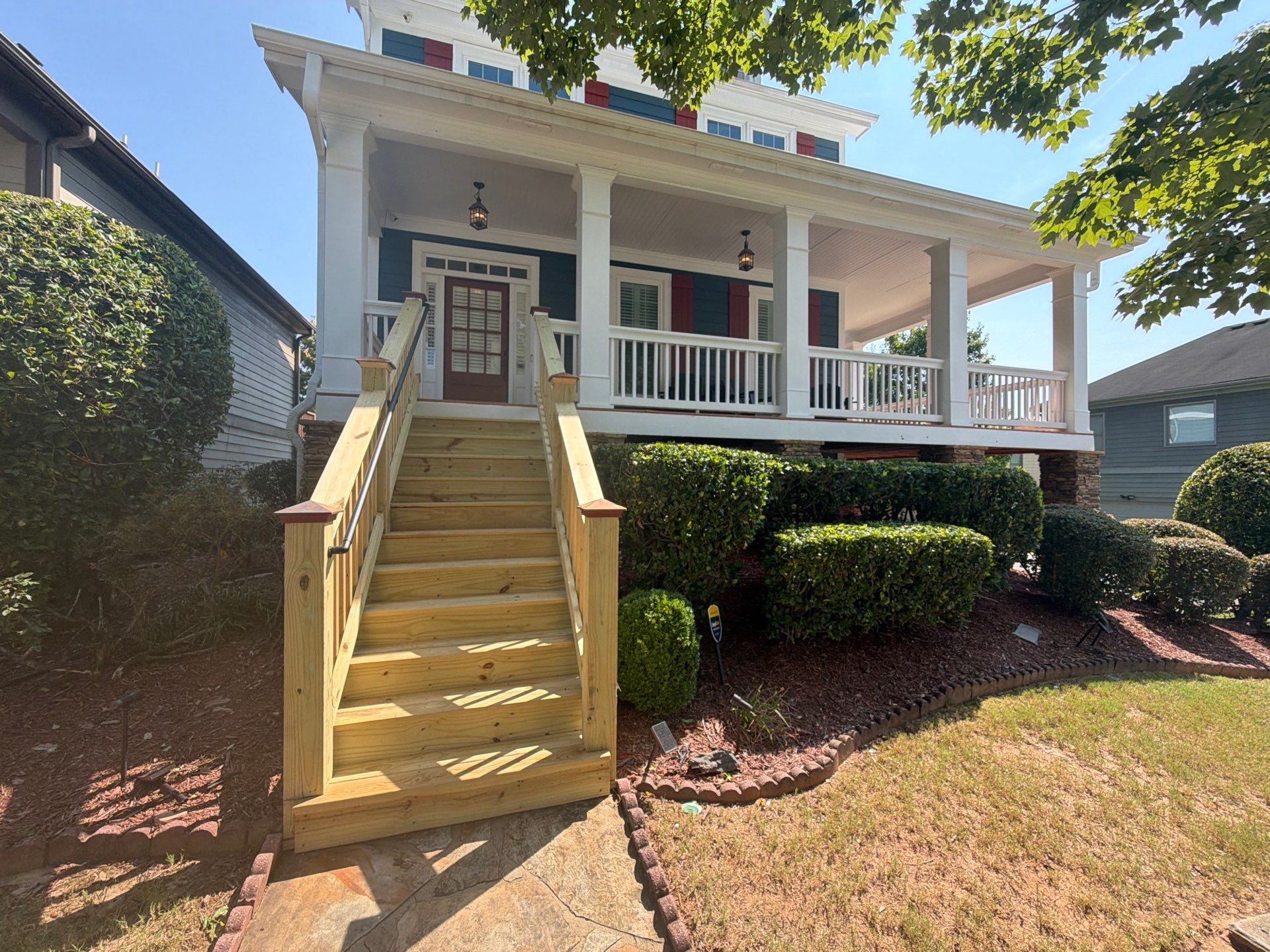 Atlanta Exterior Home Refresh with Blue Siding and Deck Staining by Swift Home Renovations 