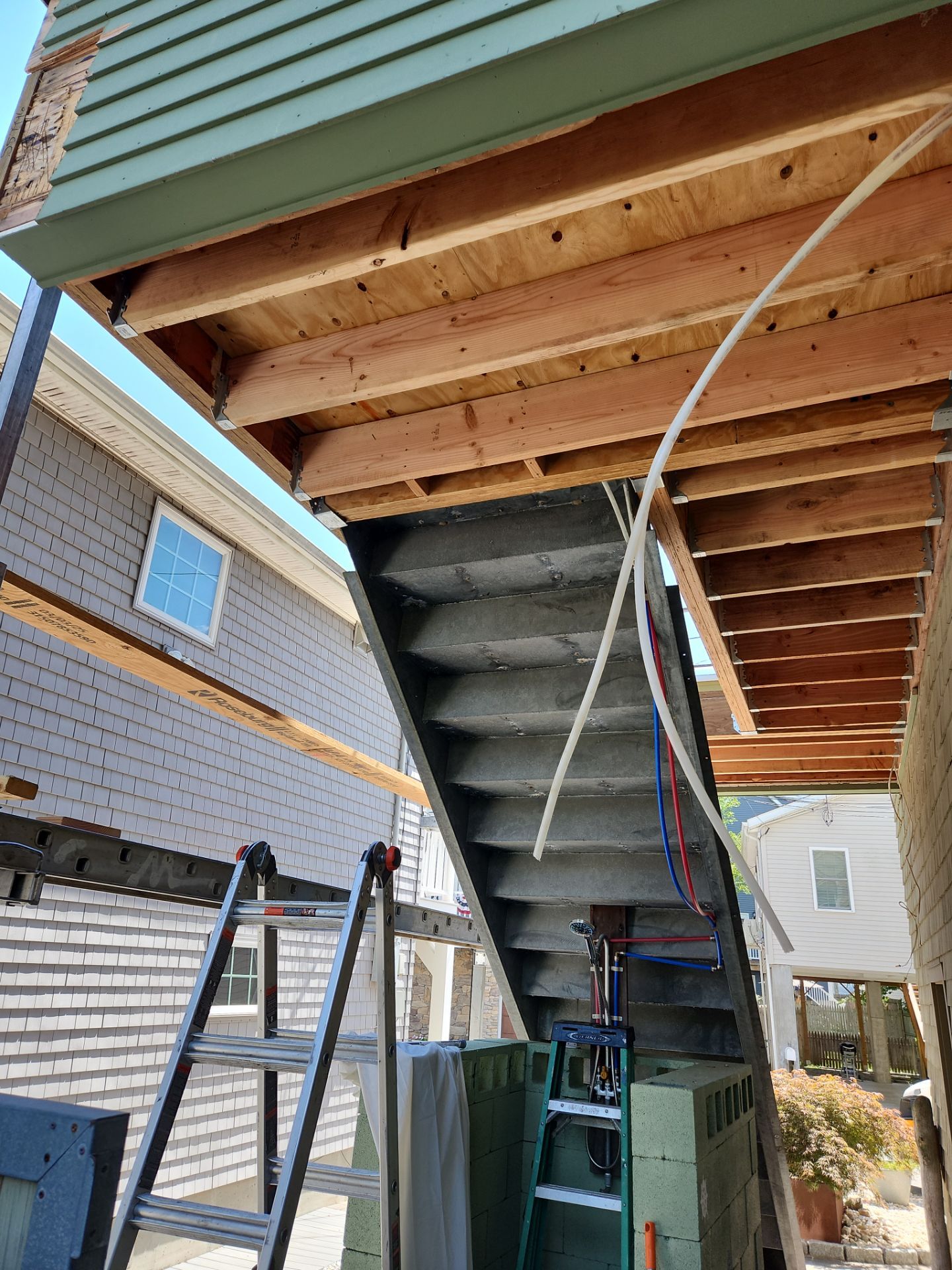 Deck Installation using Tanzite Stone Decking by A Plus Exterior