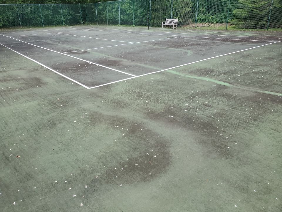 Tennis court cleaning by Northern Power Washing LLC.