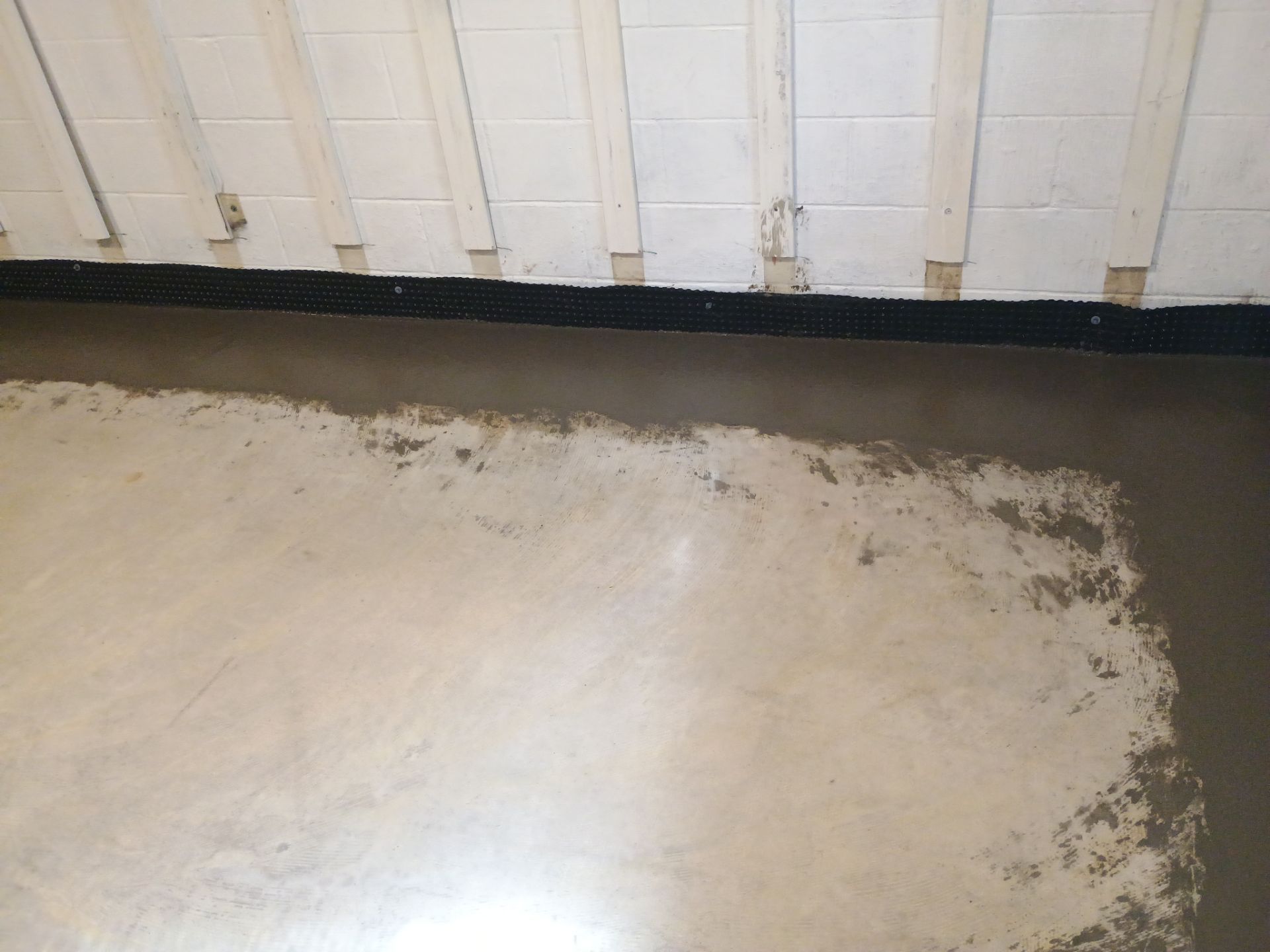 Interior Drain Tile & Buried Discharge in St. Anthony, MN by Waterproofing Northeast