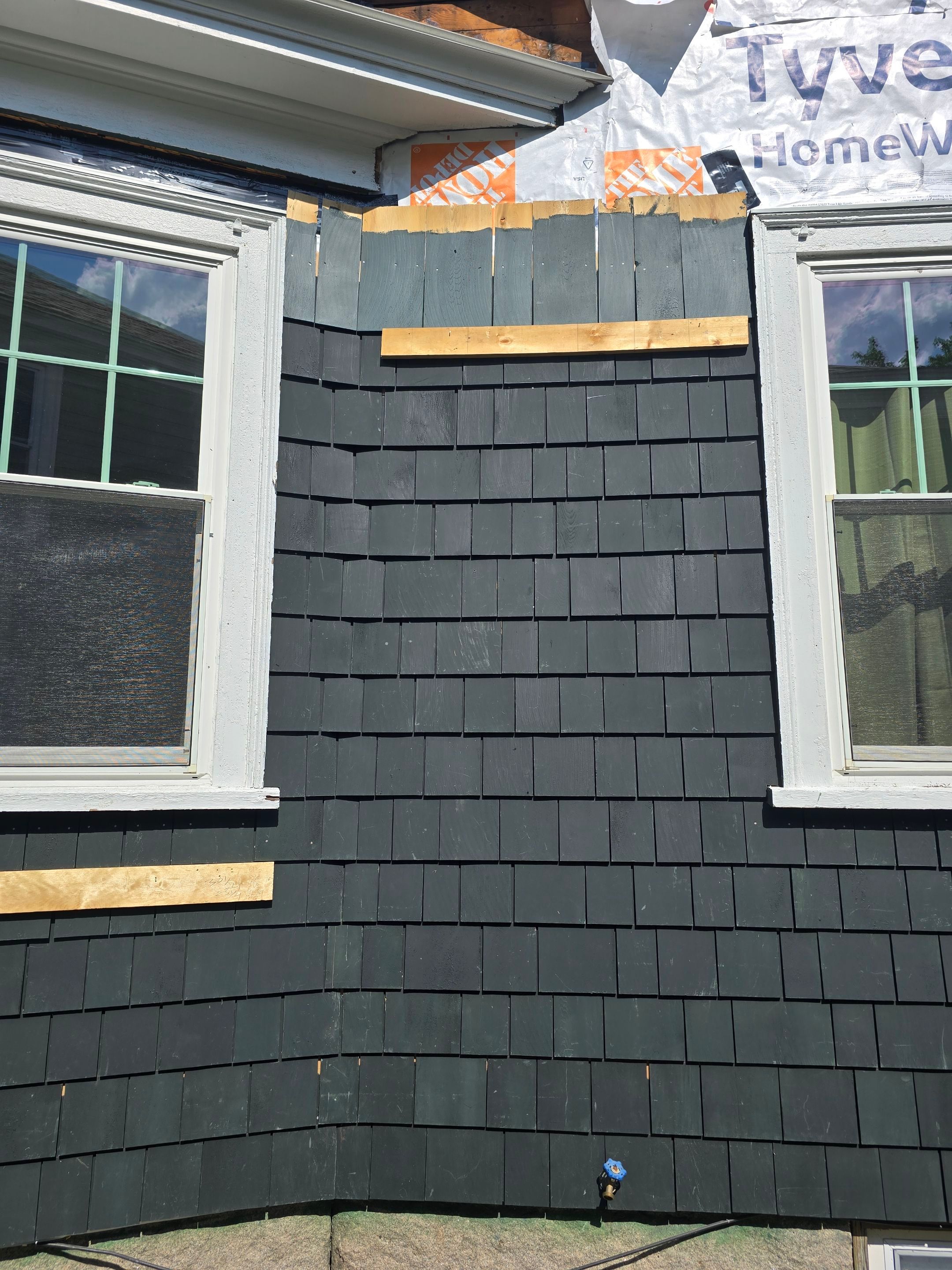 Siding replacement using cedar shakes by Freedom Handyman Services