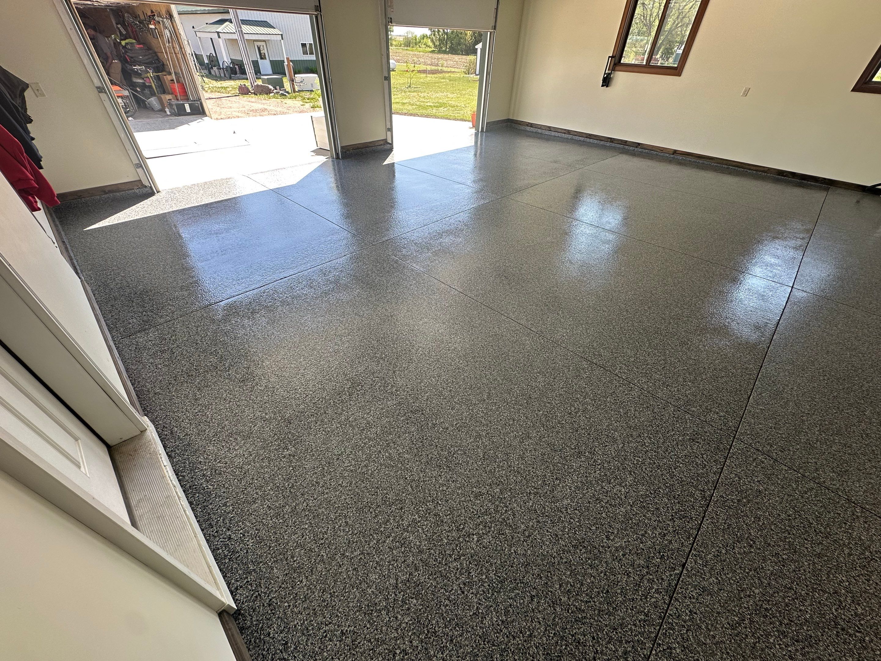 Speckled Epoxy Garage Floor Coating and Concrete Repair in Lennox by Select Painting, Coatings & Garage Cabinets