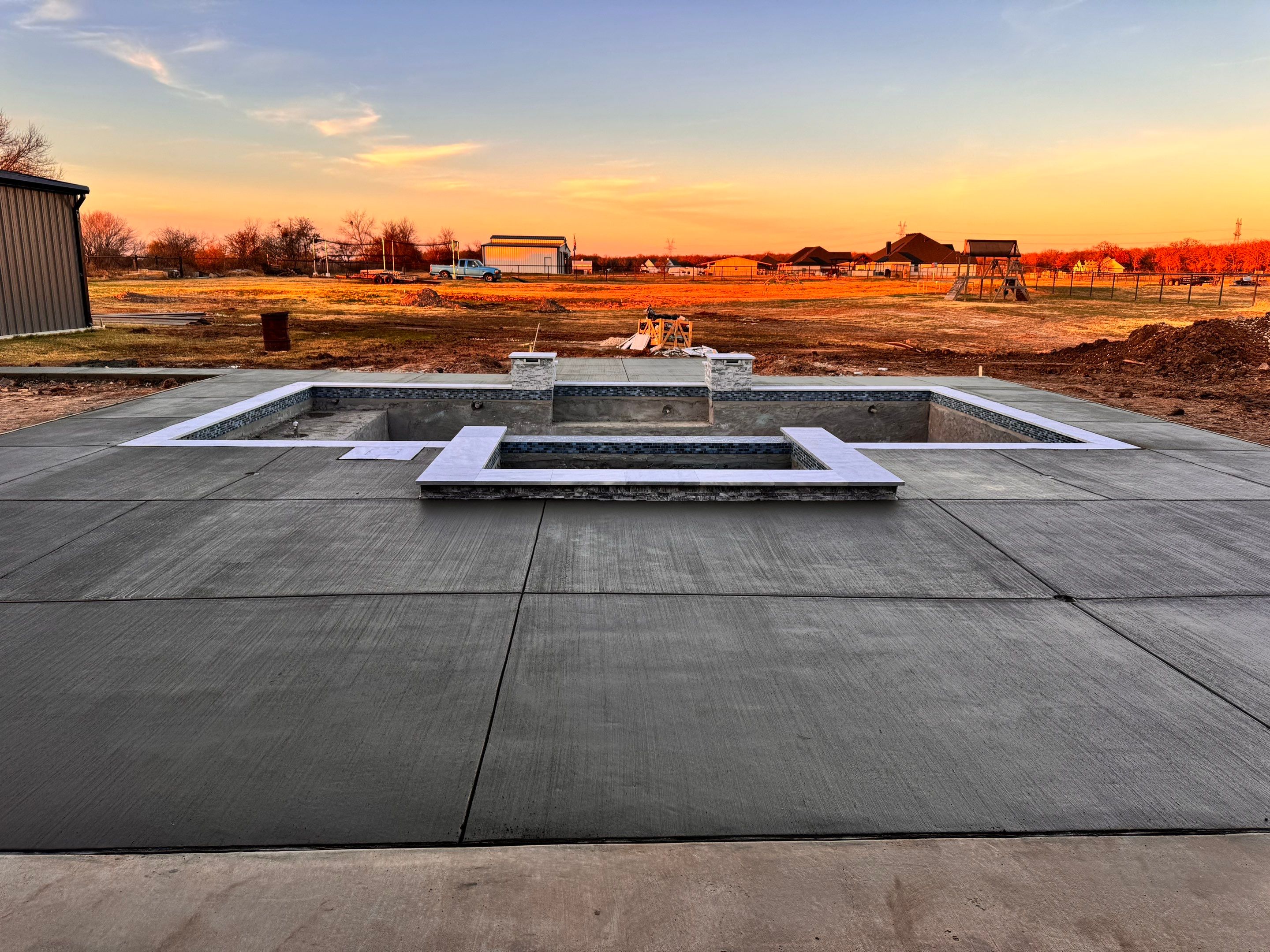 Geometric Pool with Tanning Ledge and Cedar Pergola by Pinnacle Pools and Spas - DFW