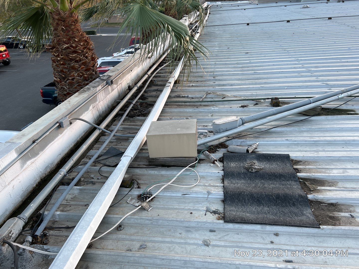 Metal roof restoration on commercial roof using Conklin Benchmark/ PUMA XL acrylic coatings over metal and foam by Straight Edge Roofing Inc