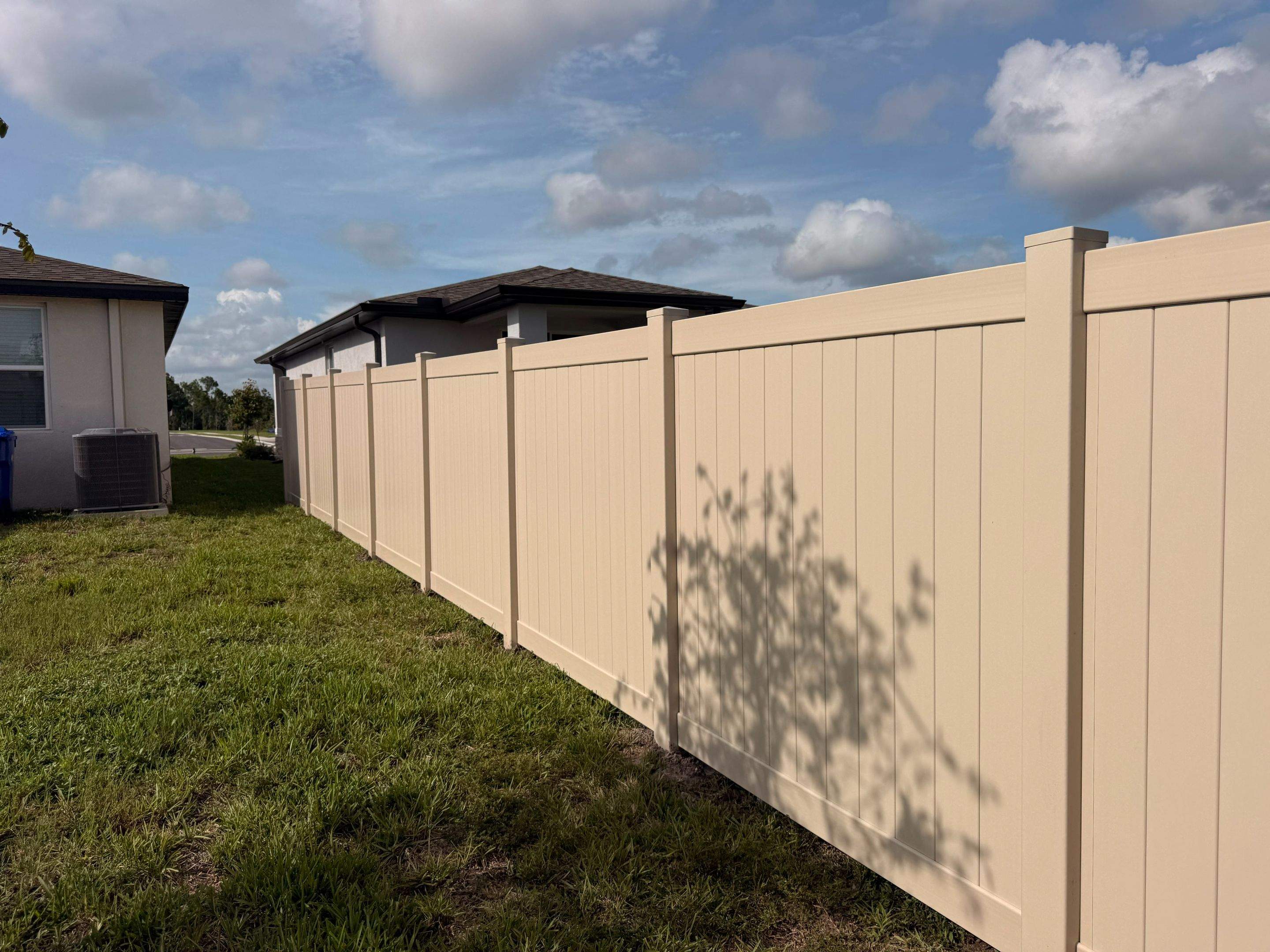 Residential Tan Vinyl Privacy Fence Installation in Nokomis by True Fence LLC