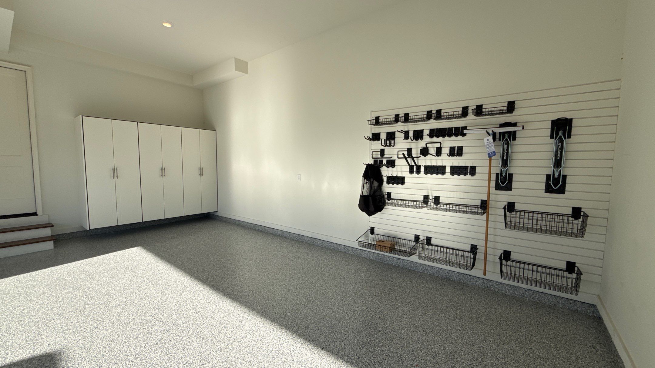Garage Remodel with Custom Cabinets and Epoxy Floors in Overland Park by Banner Garage