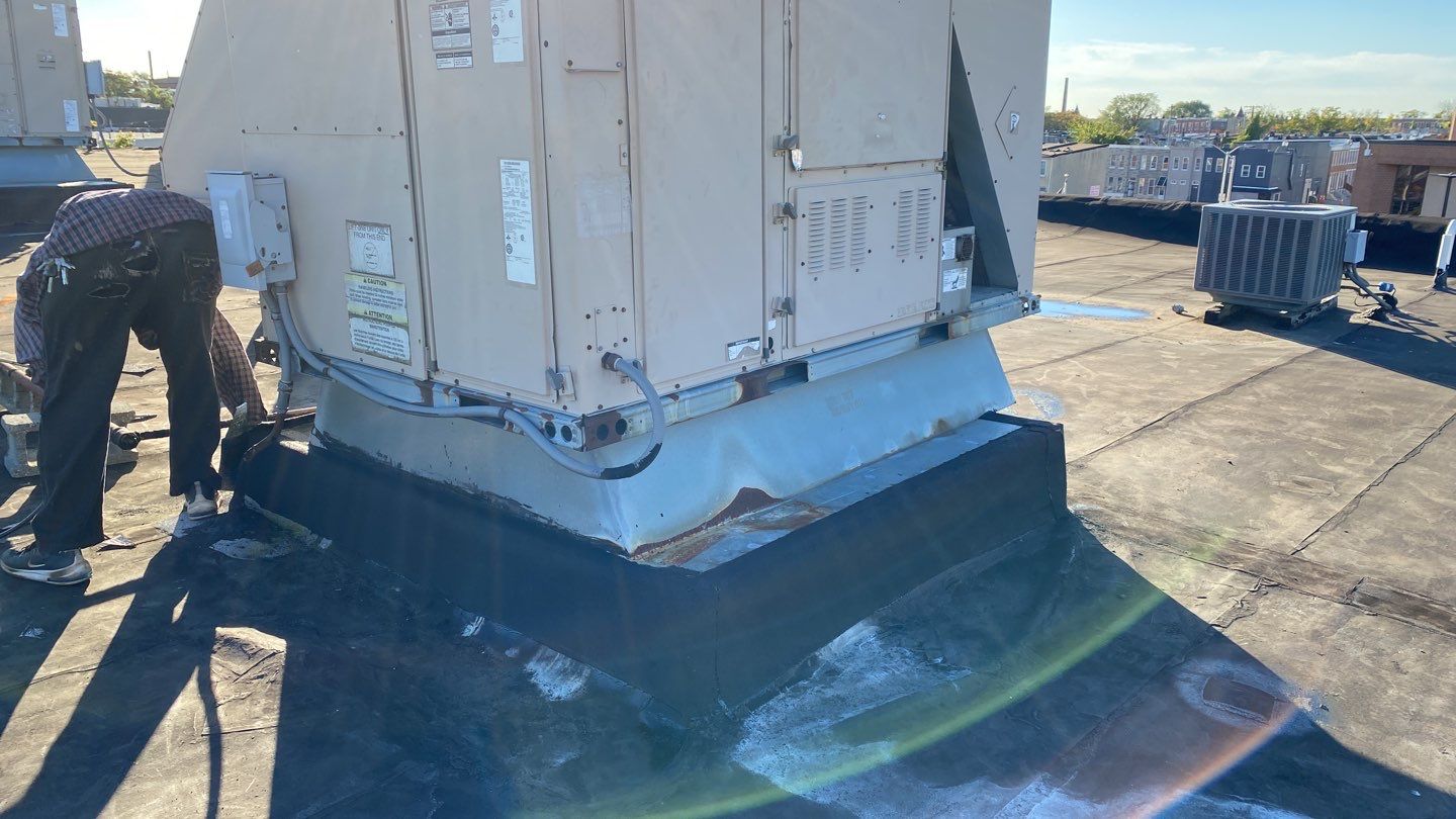 Commercial Roofing Repair using new Flashing by Alpha Design Services