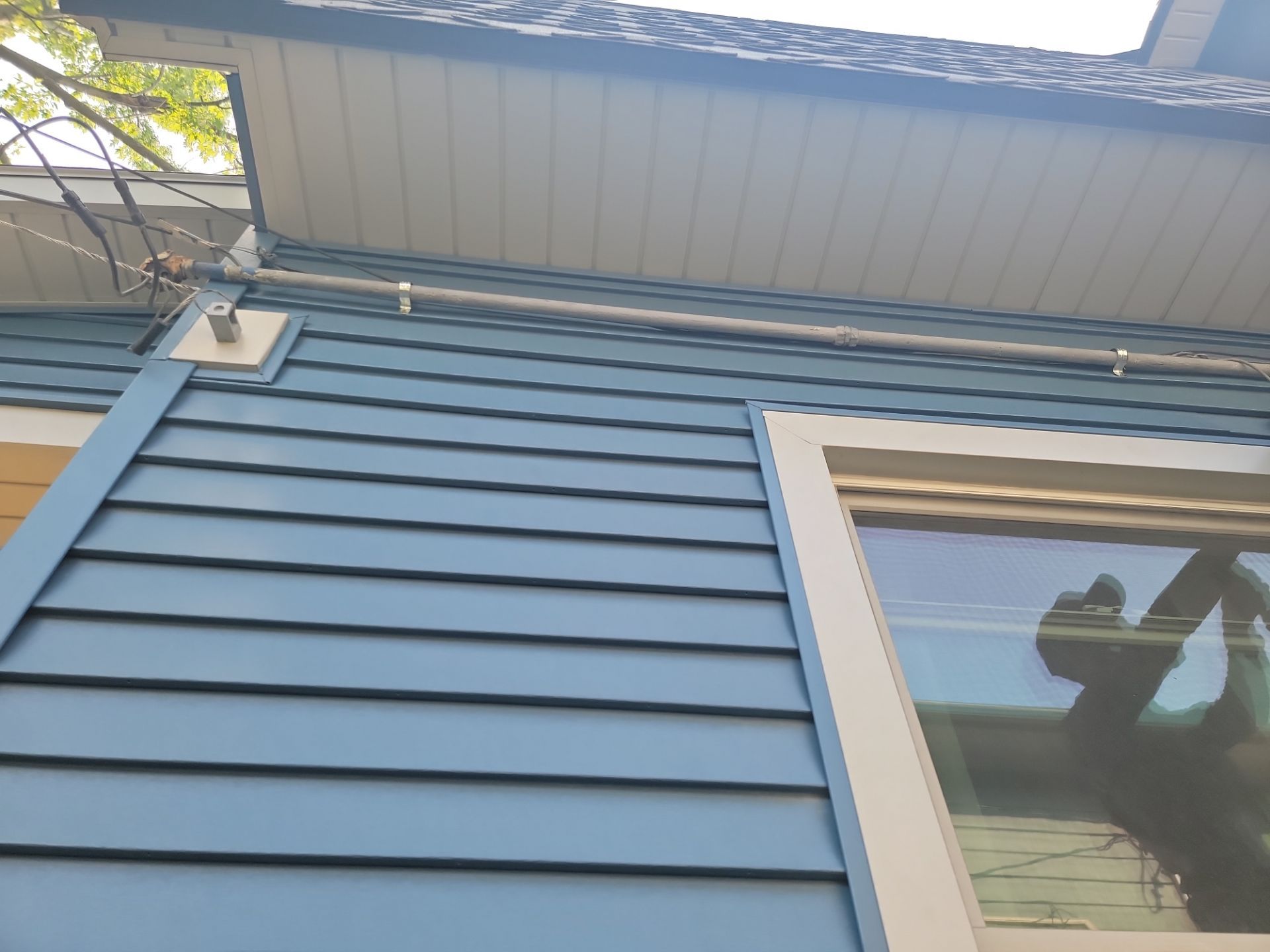 SIDING, DECK AND NEW PORCH  by Avalon Roofing and Exteriors