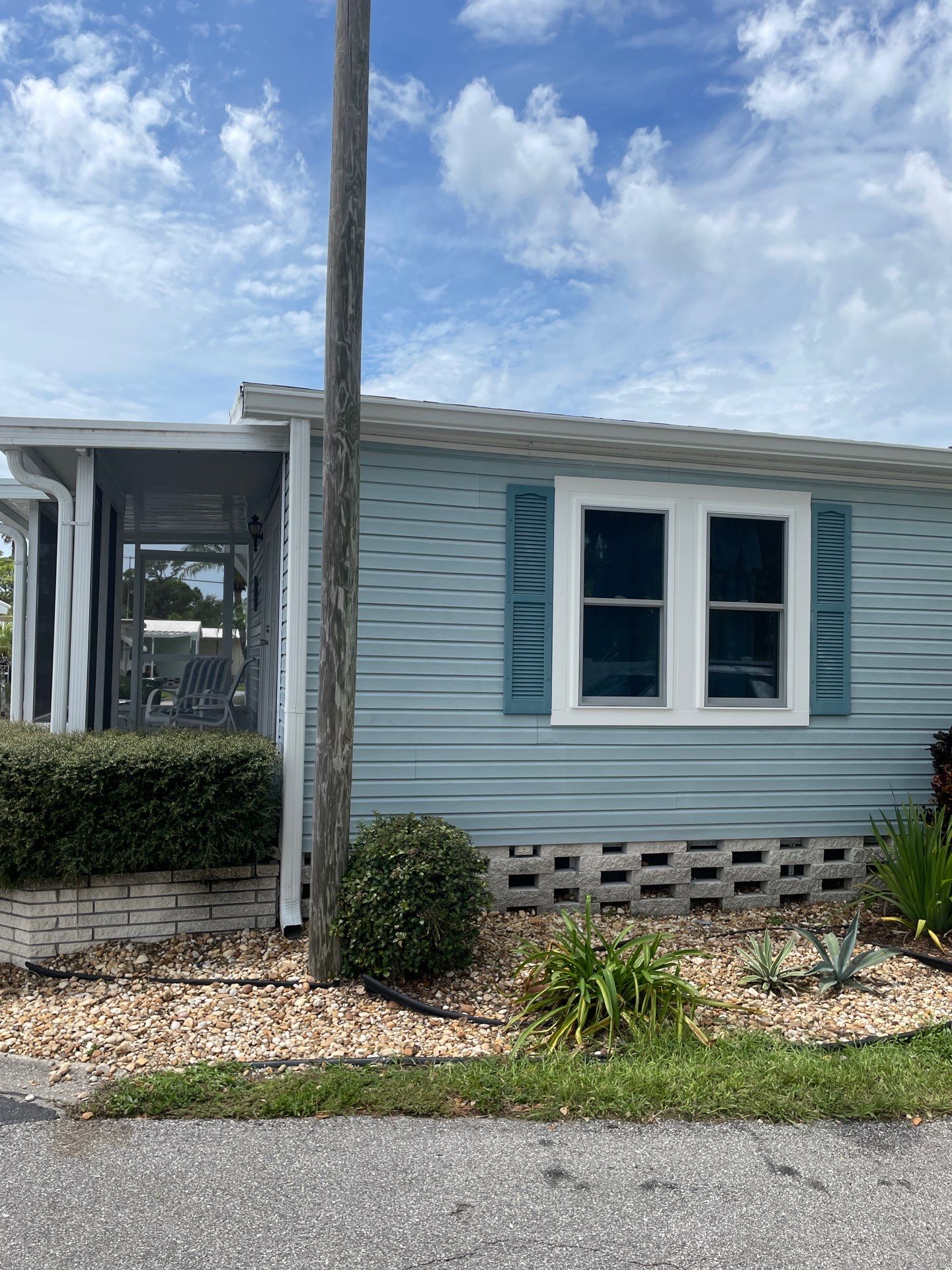 6-inch white seamless gutters in Sarasota FL by Gutter Professors