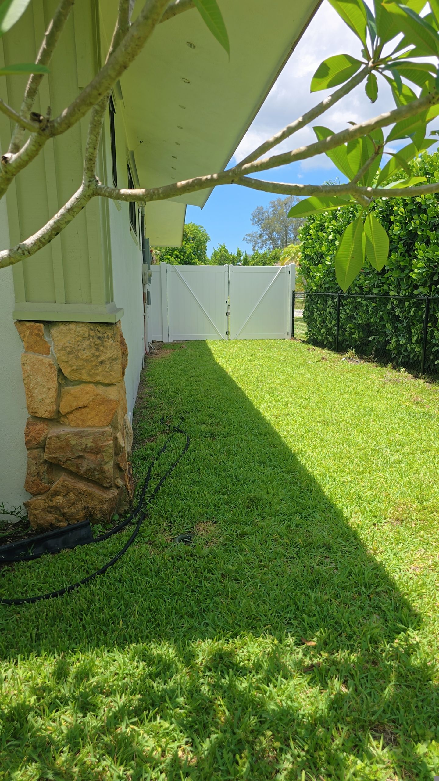 Residential Chain Link Fence Repair and Vinyl Privacy Gate Installation in Naples by True Fence LLC
