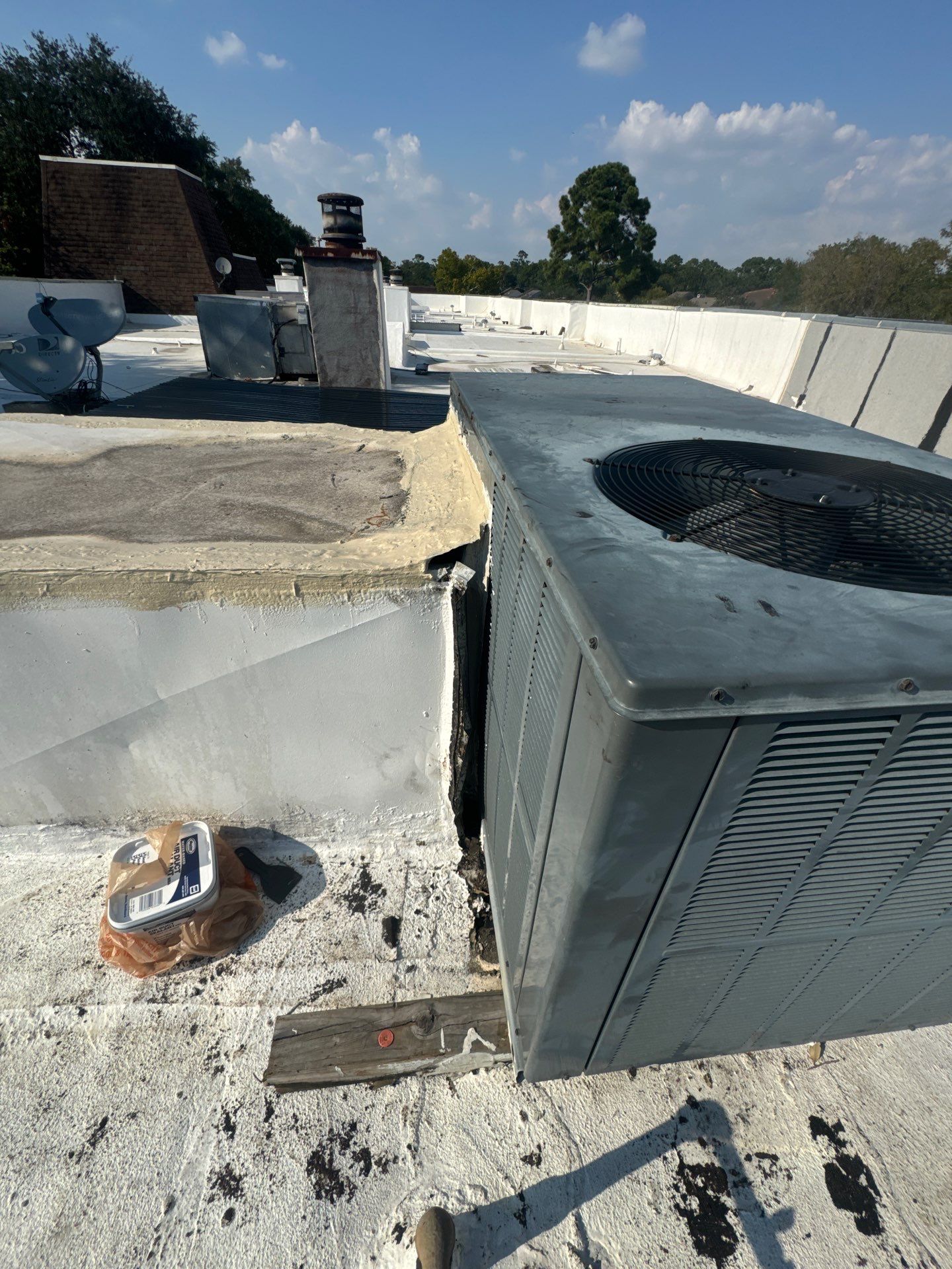 Waterproofing AC Curb covered courtyard on a flat Roof by Associates Roofing Unlimited