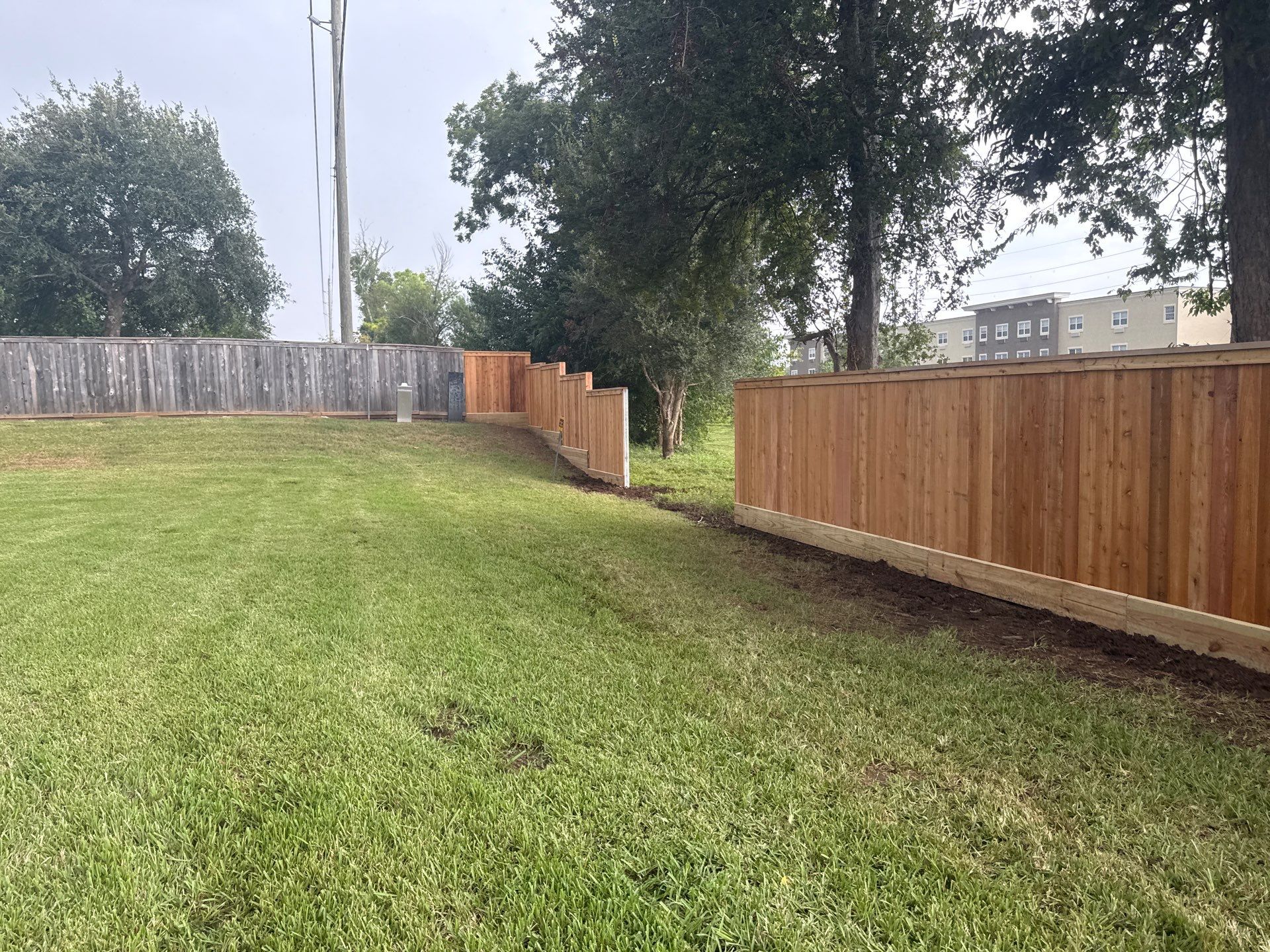 Wood Fence Installation for HOA by Tim's Fences