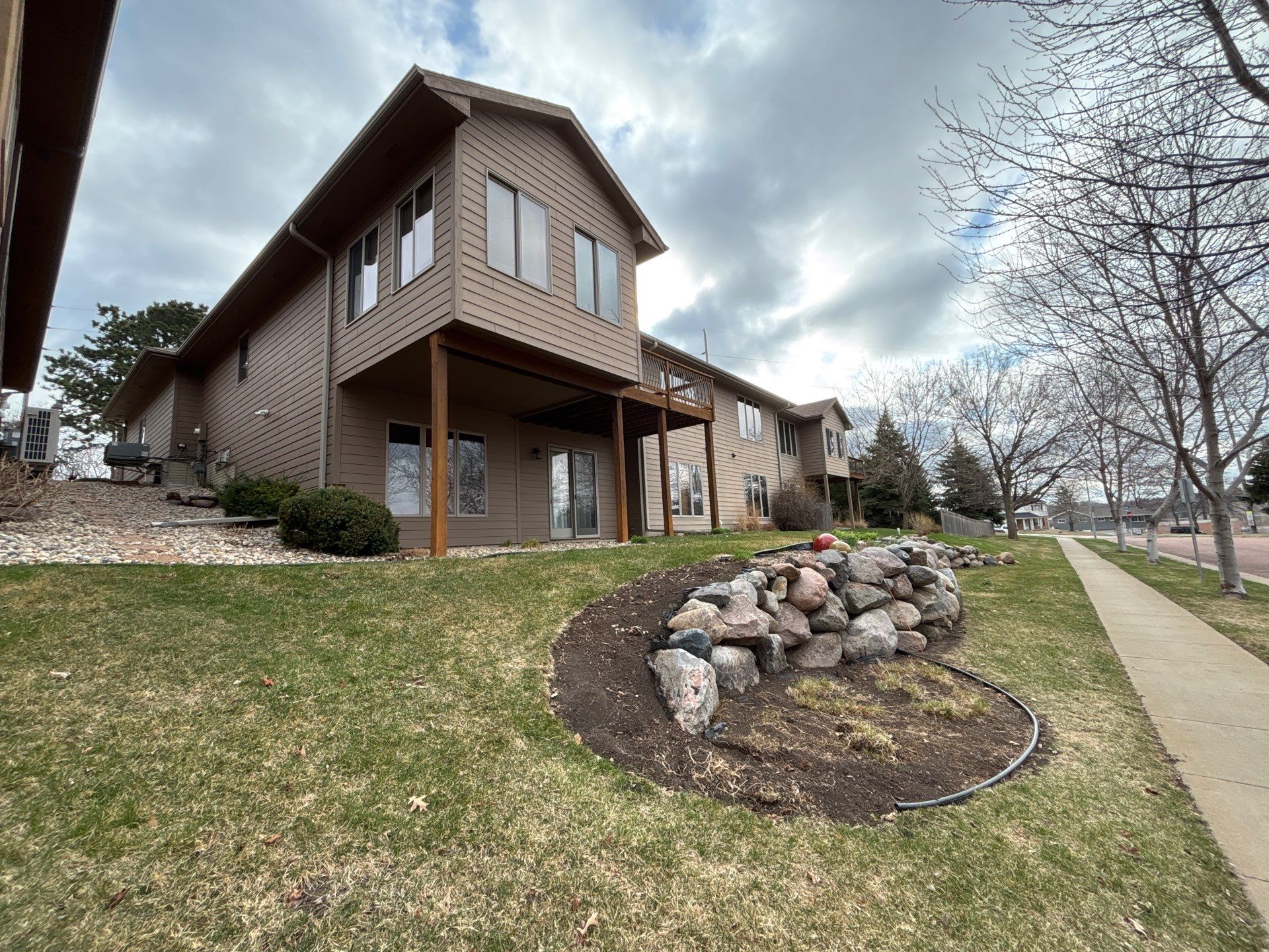 Multi-Story Residential Exterior Painting and Siding Refresh in Sioux Falls by Select Painting, Coatings & Garage Cabinets